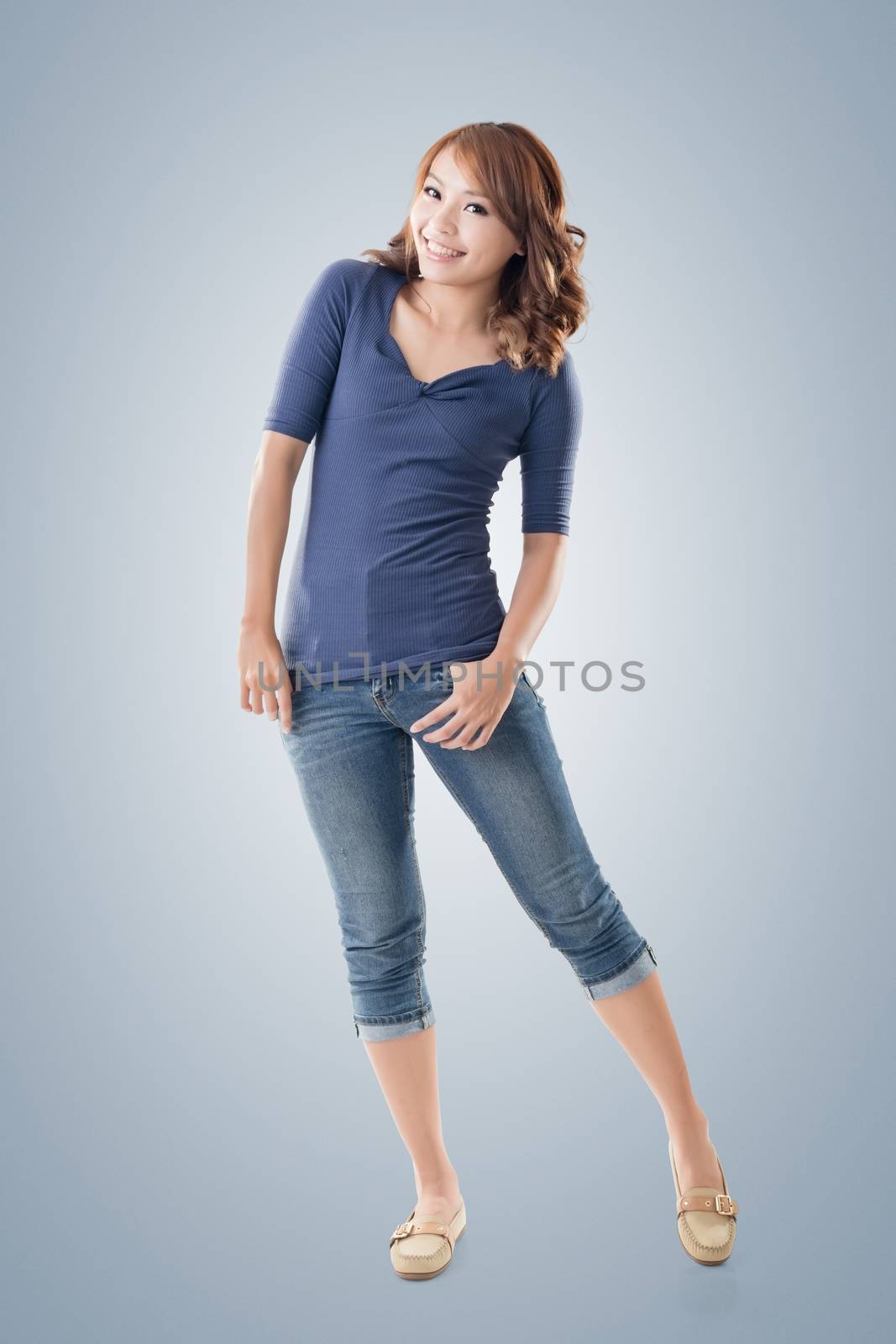 Excited Asian young girl, full length portrait isolated.