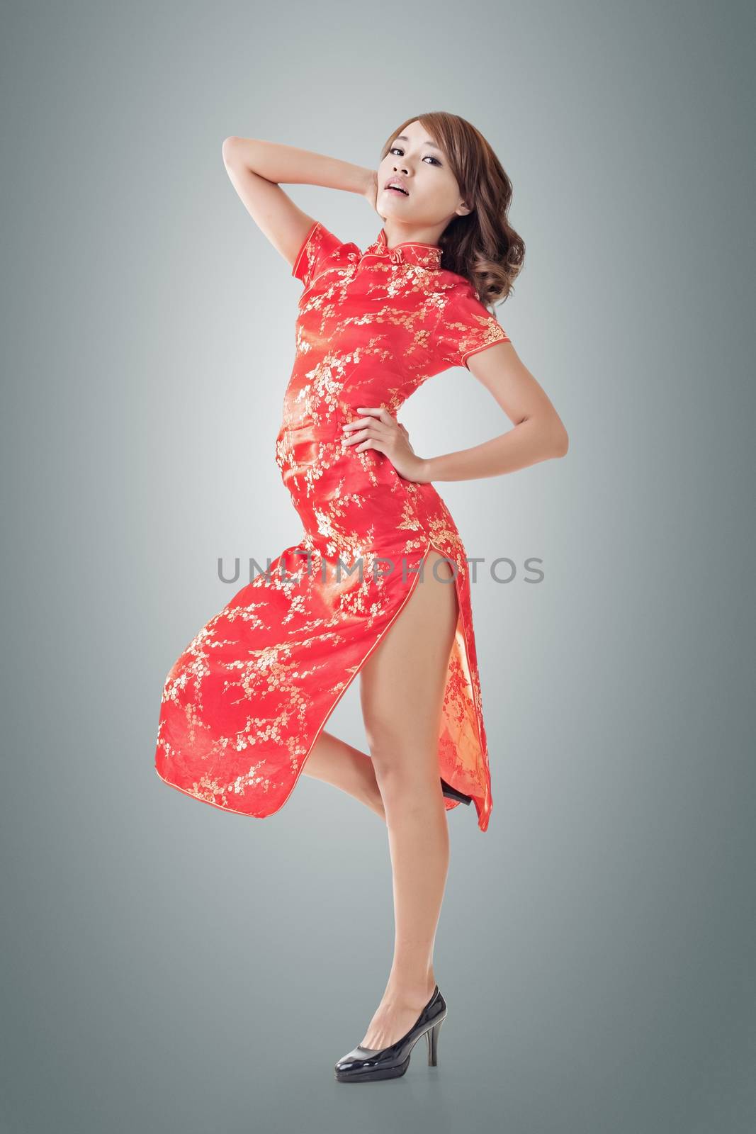 Chinese woman dress traditional cheongsam at New Year, full length portrait isolated.