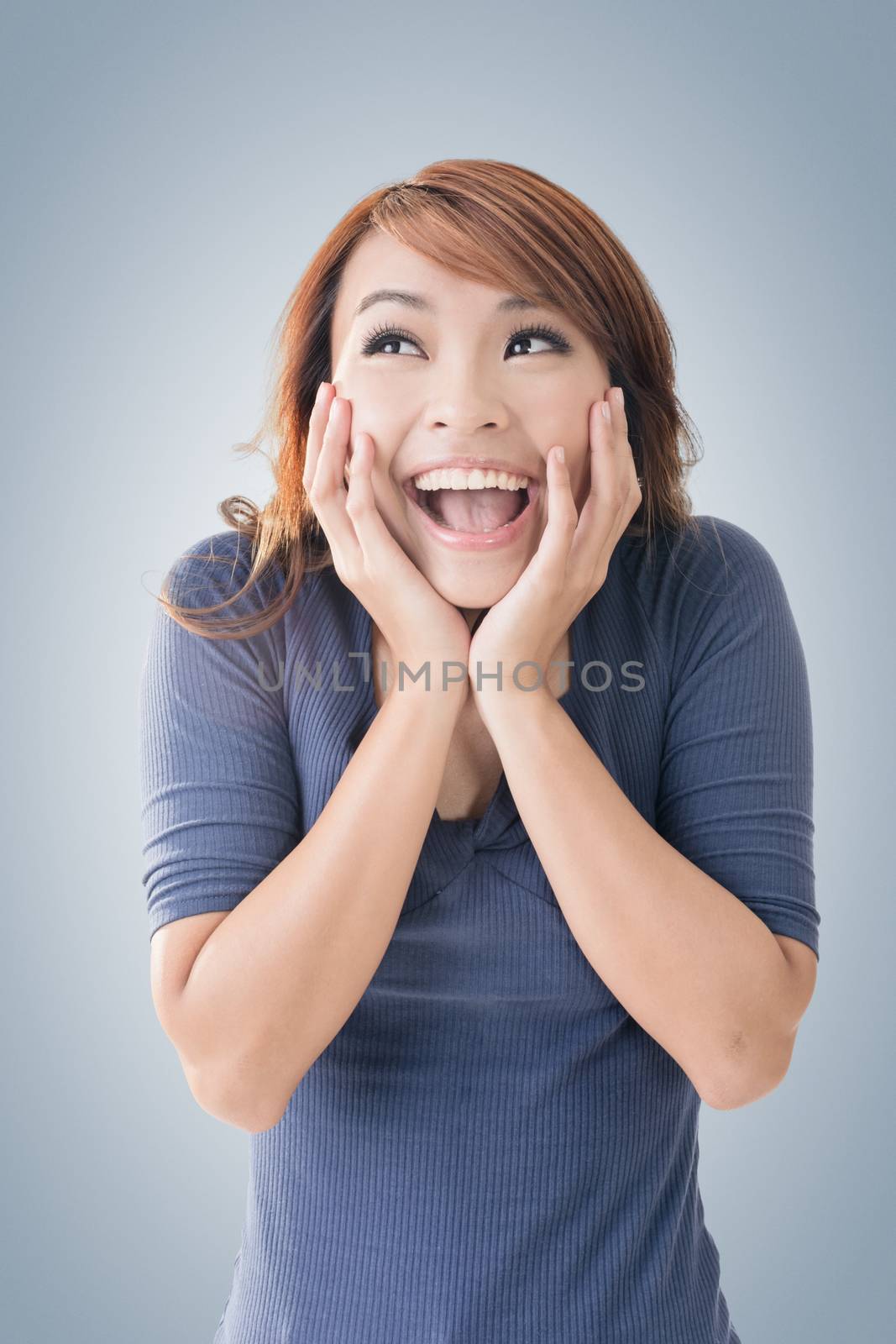 Excited happy Asian girl face, closeup portrait.