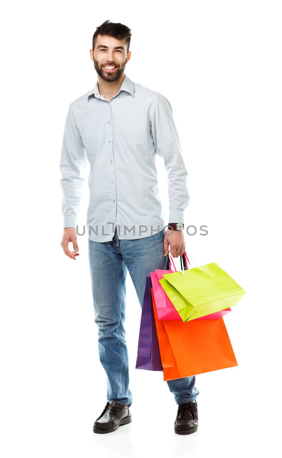 Handsome man holding shopping bags on white background by vlad_star