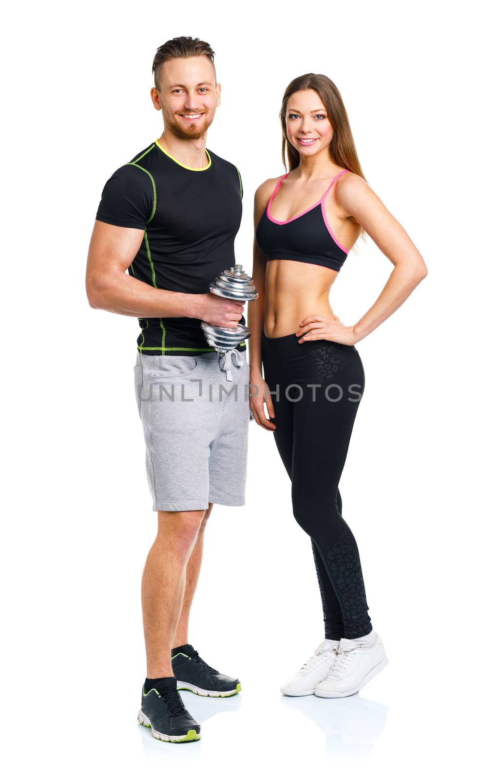 Athletic man and woman with dumbbells on the white by vlad_star