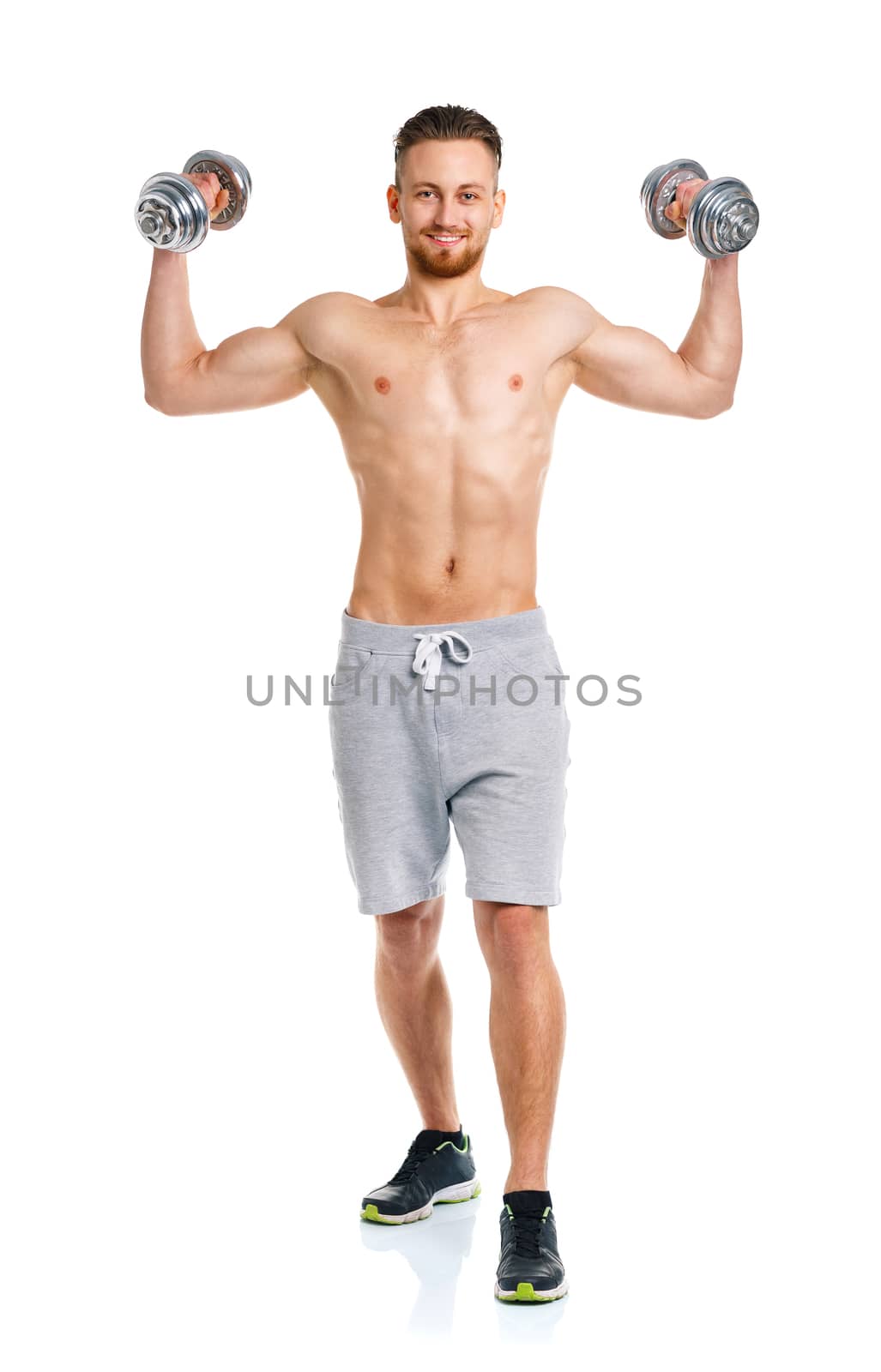 Athletic man with dumbbells on the white background