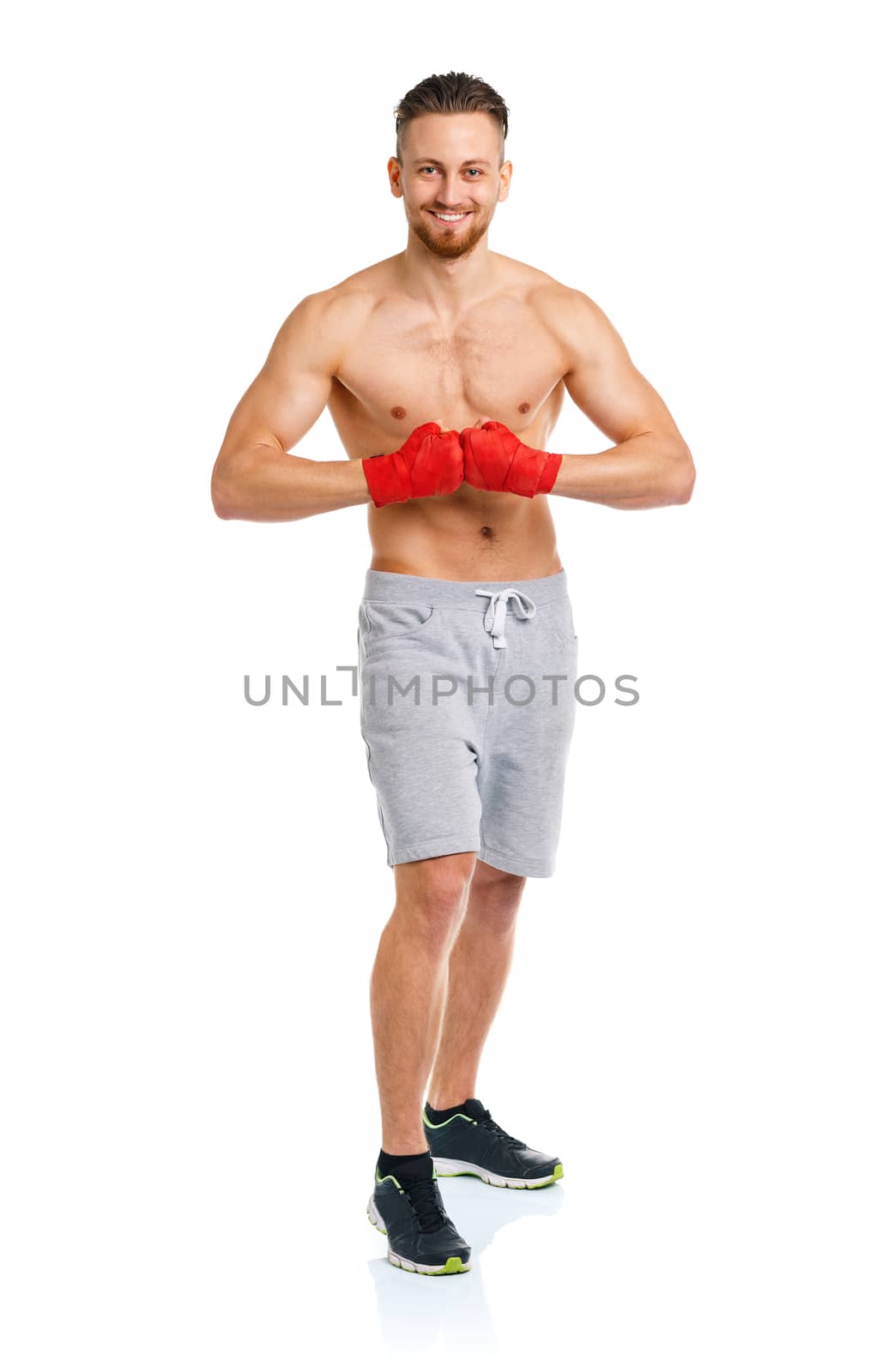 Athletic attractive man wearing boxing bandages on the white background