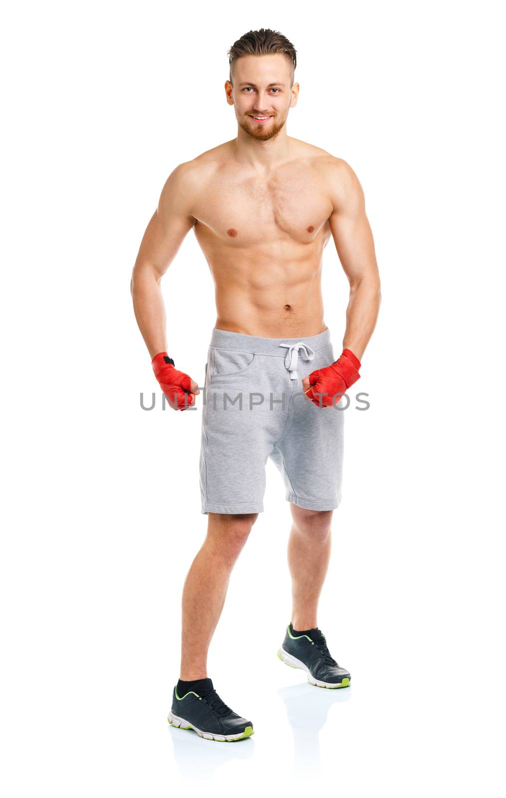 Athletic attractive man wearing boxing bandages on the white by vlad_star