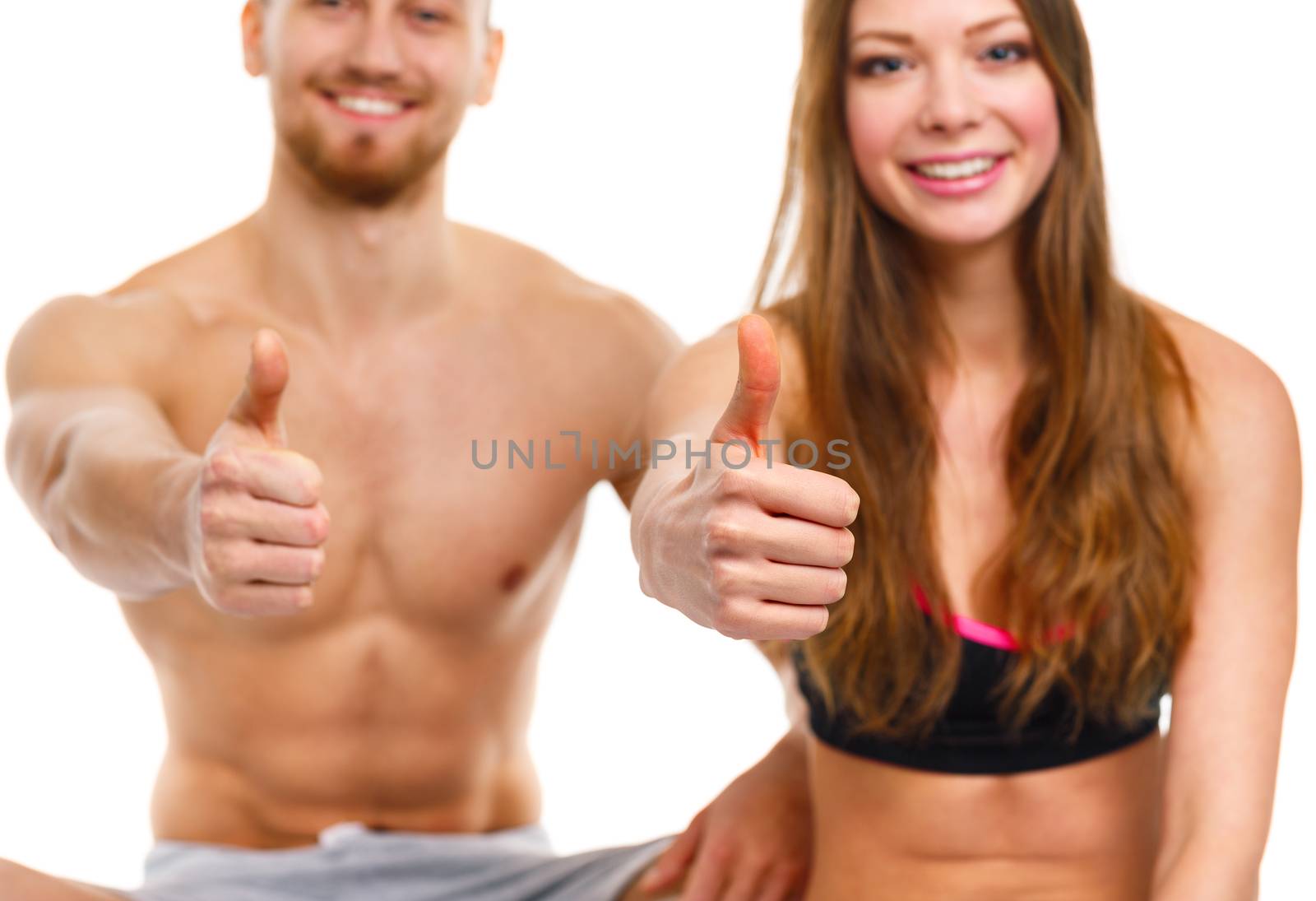 Athletic man and woman after fitness exercise with a finger up o by vlad_star