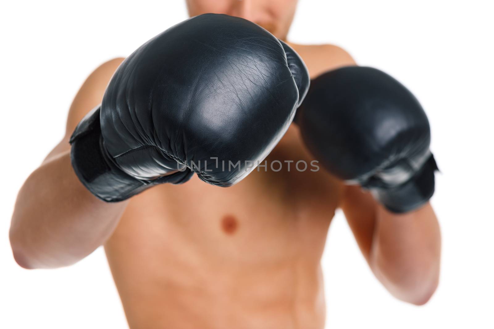 Athletic attractive man wearing boxing gloves on the white background