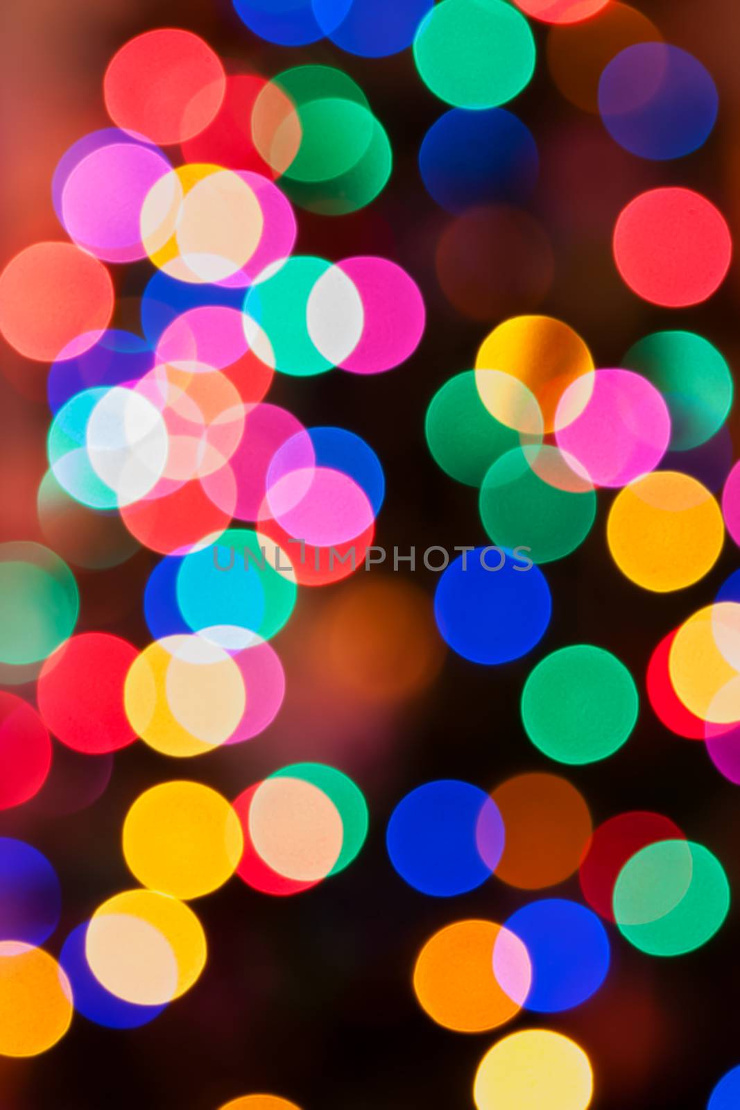 Glowing Christmas lights background in soft focus by Coffee999