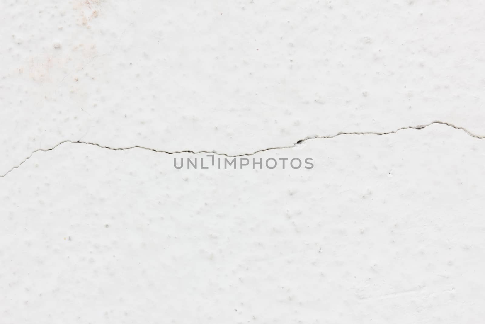 white background of natural cement or stone with crack