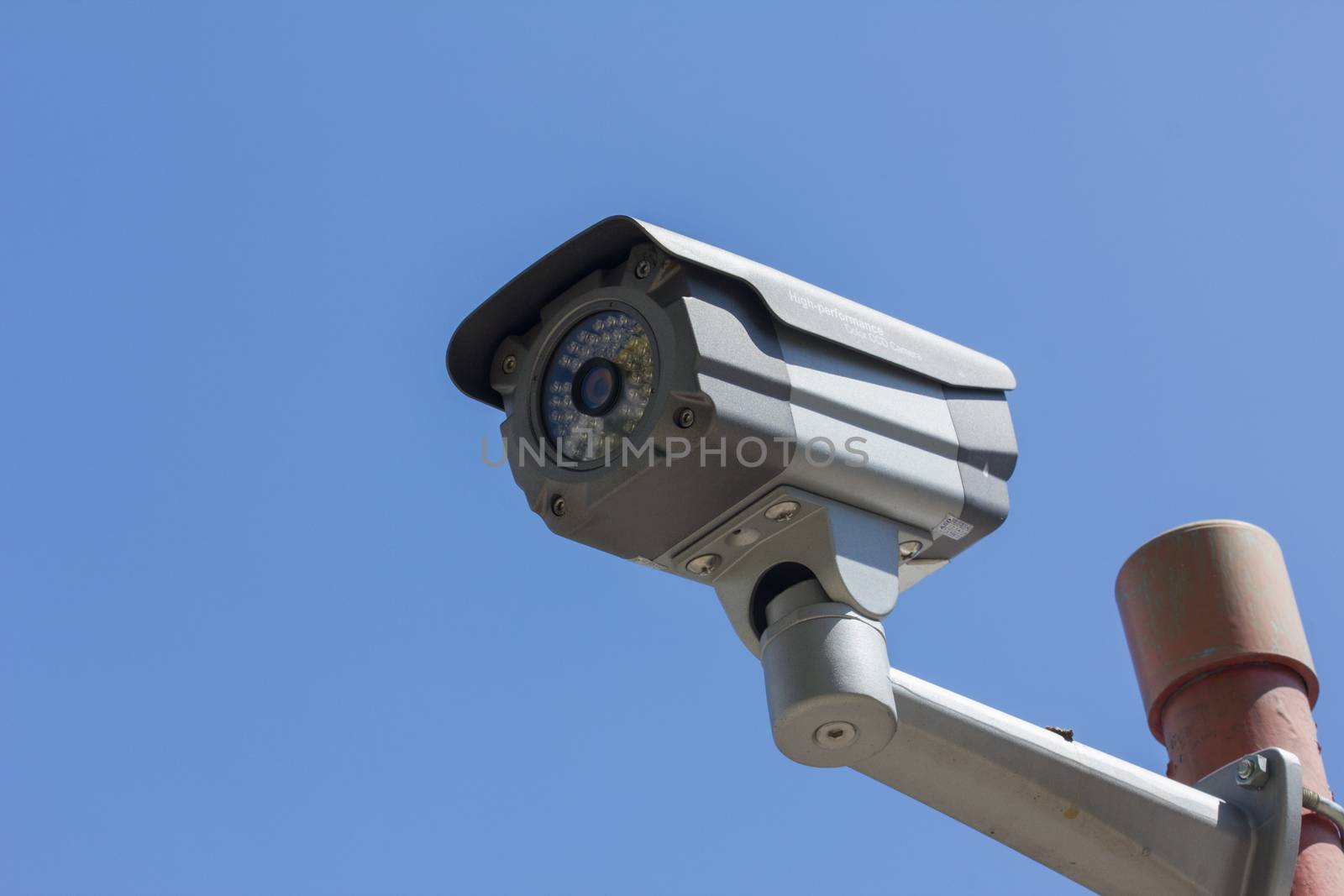 security camera on blue sky background