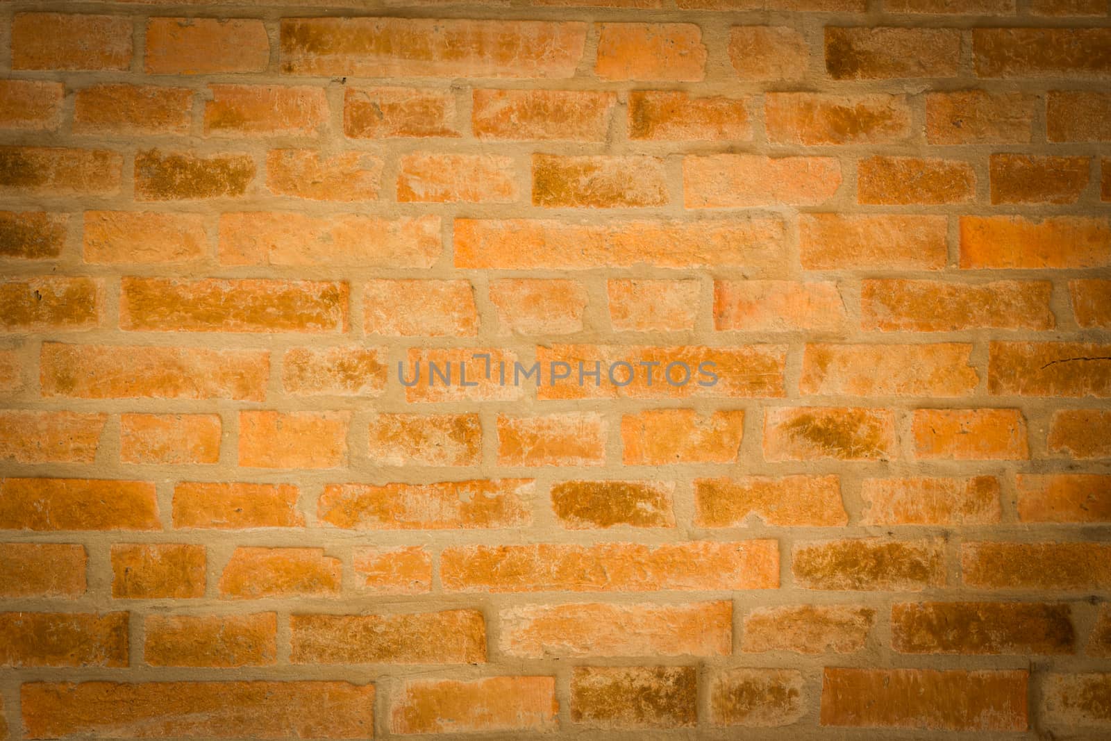 red brick wall texture background with vignetted corners to interior design