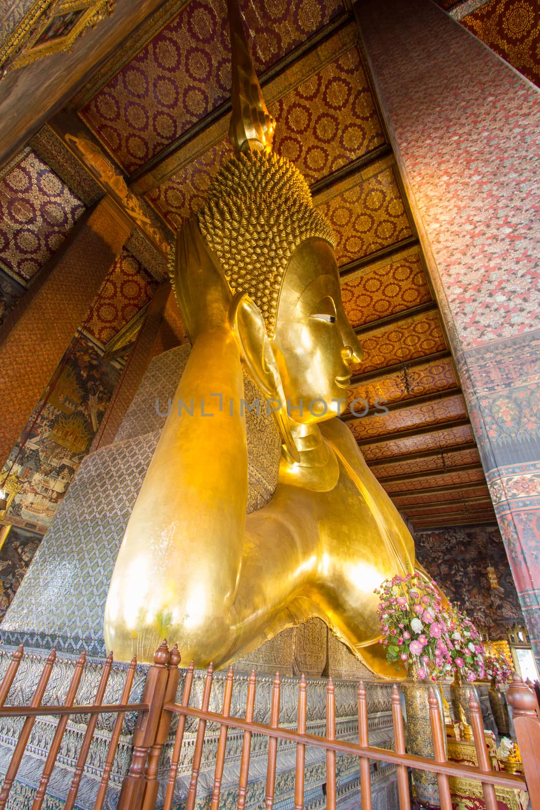 The Big golden Reclining Buddha within Wat Pho is the important in Bangkok, Thailand