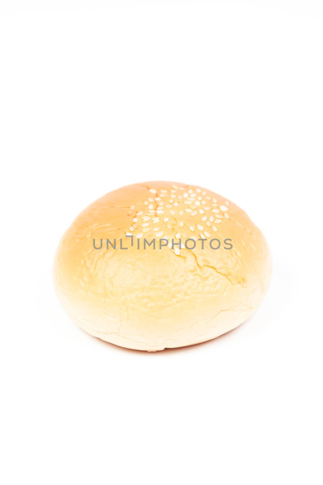 Round loaf of bread. Isolated on white background. Shooting inside the studio