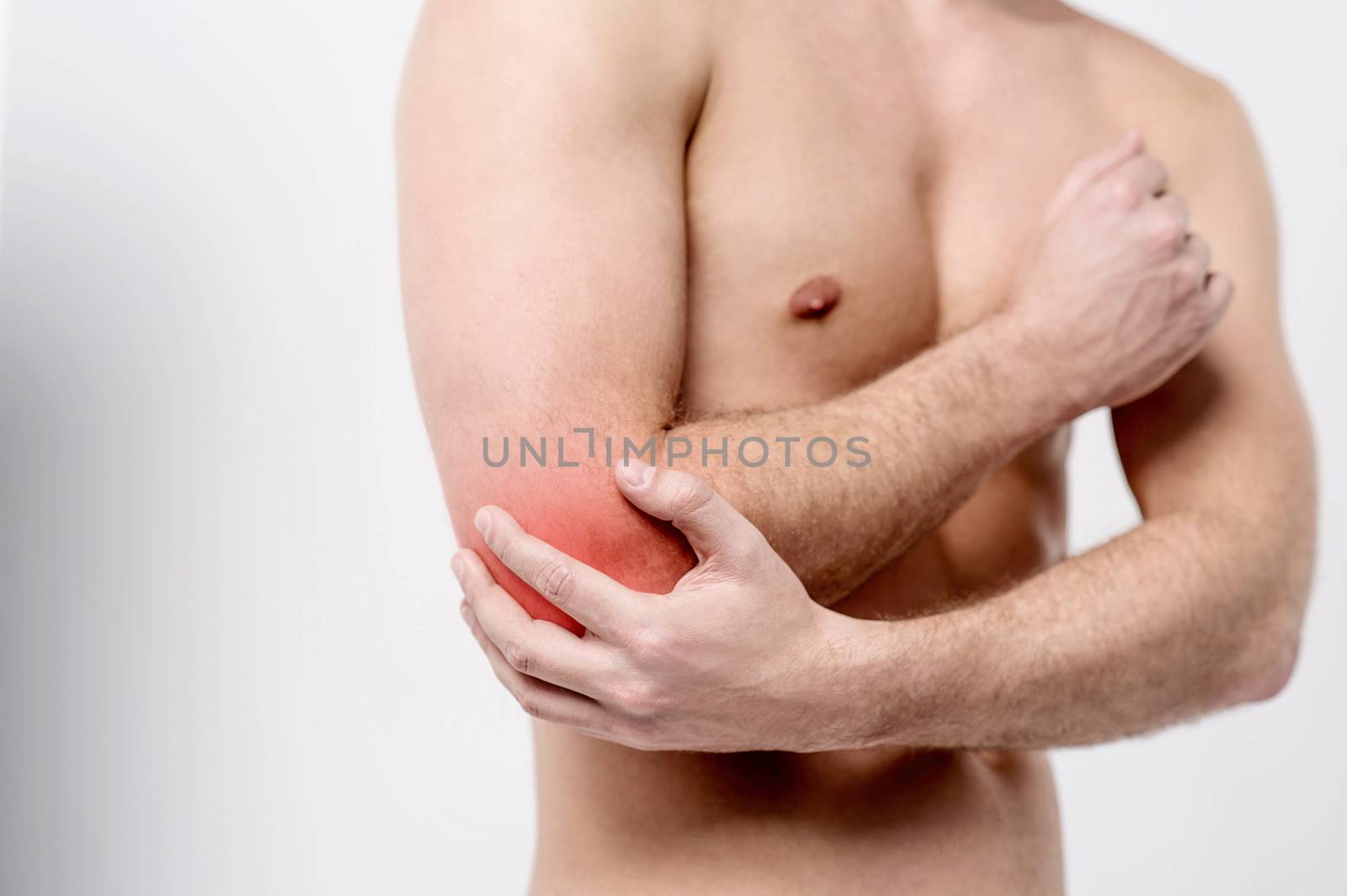 Male having pain in an elbow joint