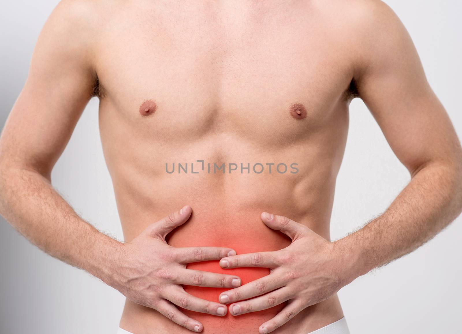 Muscular man with stomach pain