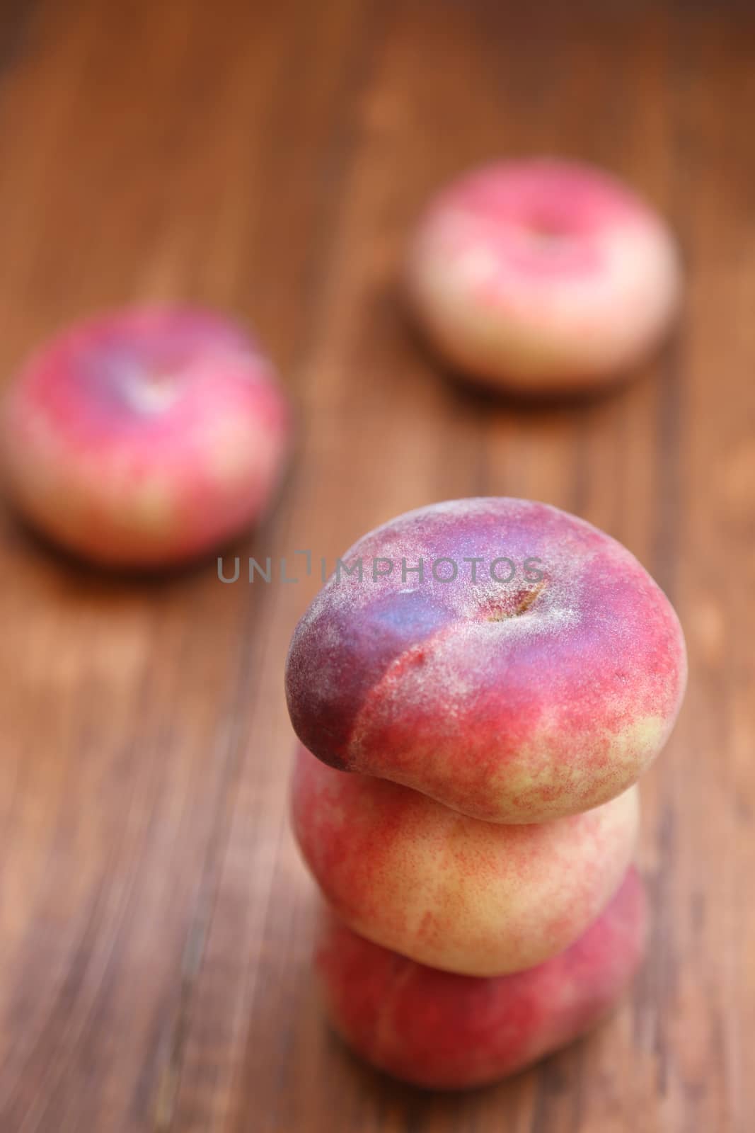 some fresh ripe  peaches on wooden background