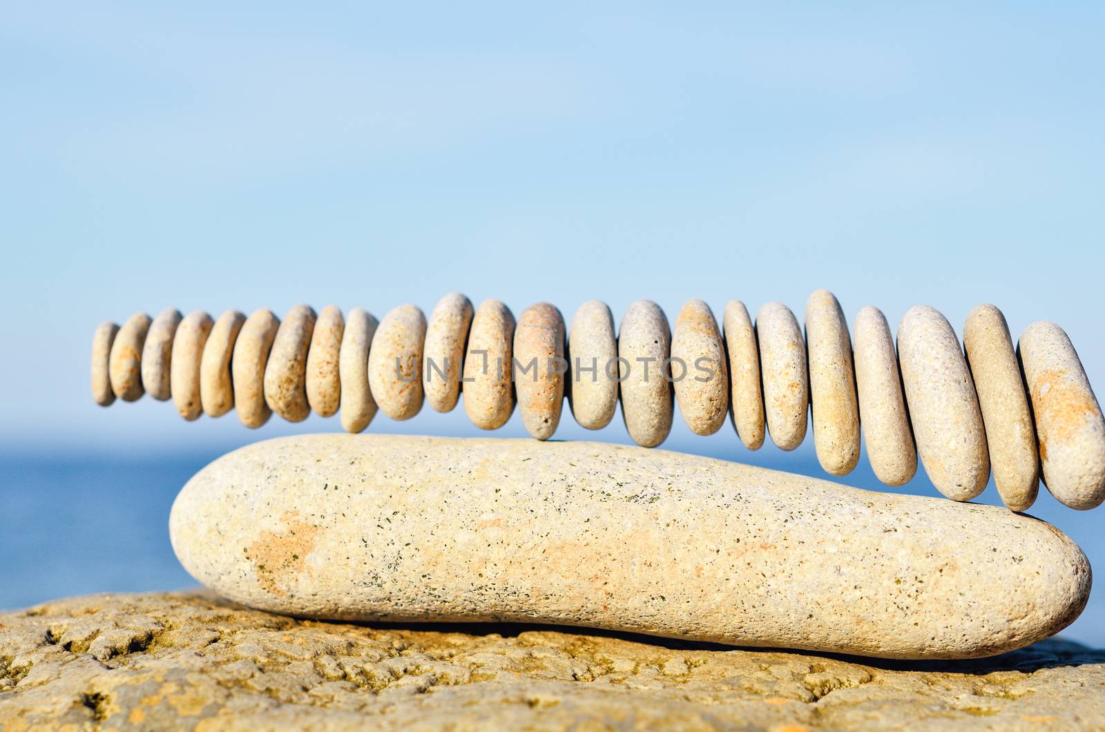 Stack of stones in connection each other on the seashore