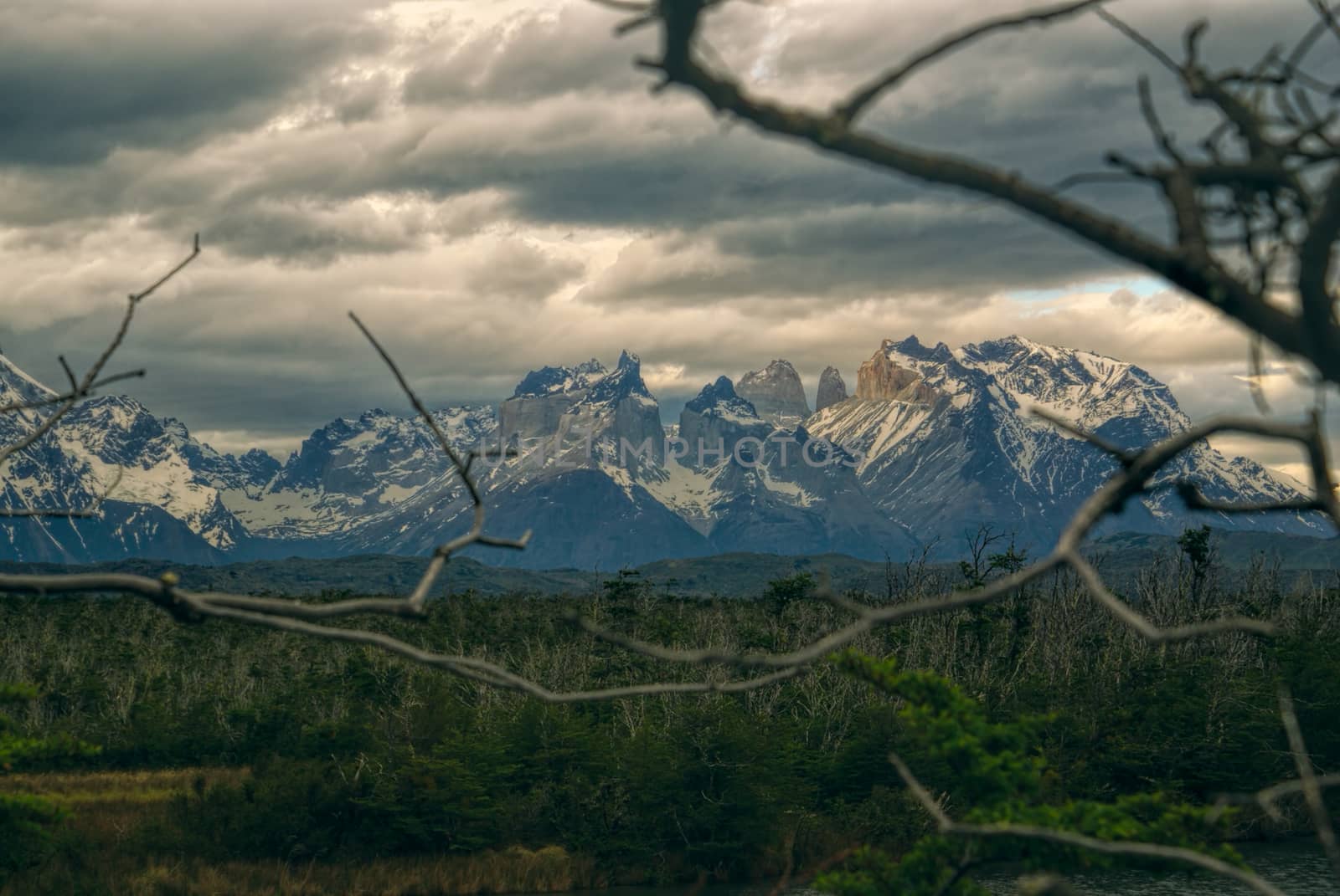 Dramatic clouds over the peaks of Torres del Paine national park in south American Andes                   