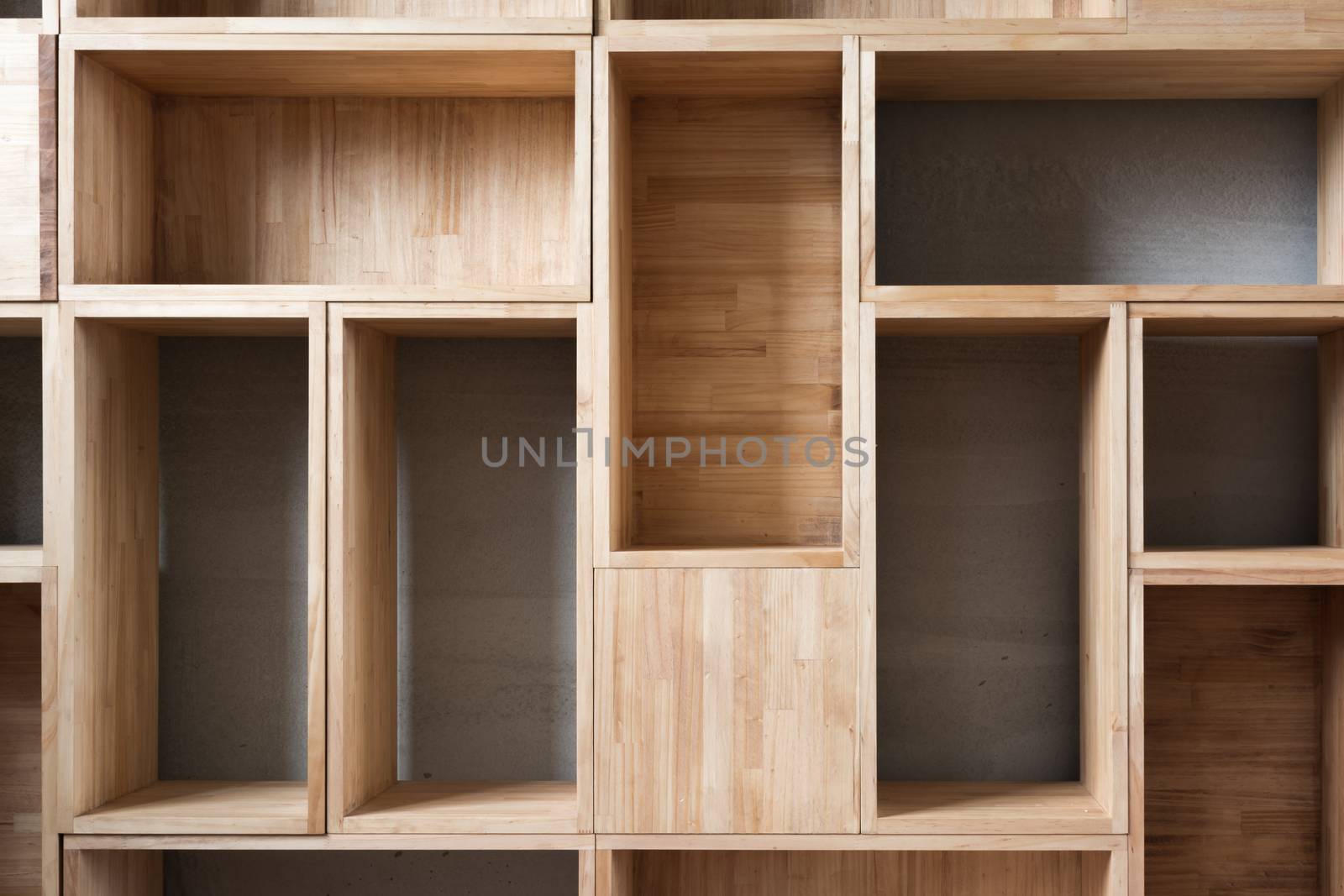 Empty wooden boxes on the ground in a room.