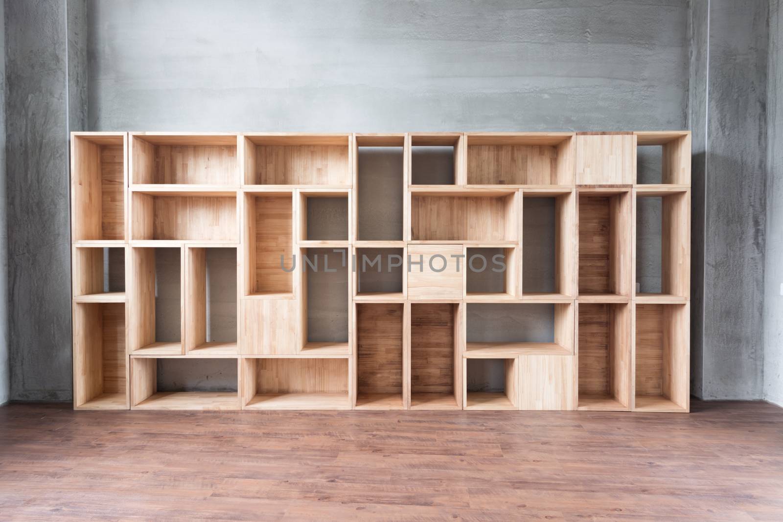 Empty wooden boxes on the ground in a room.