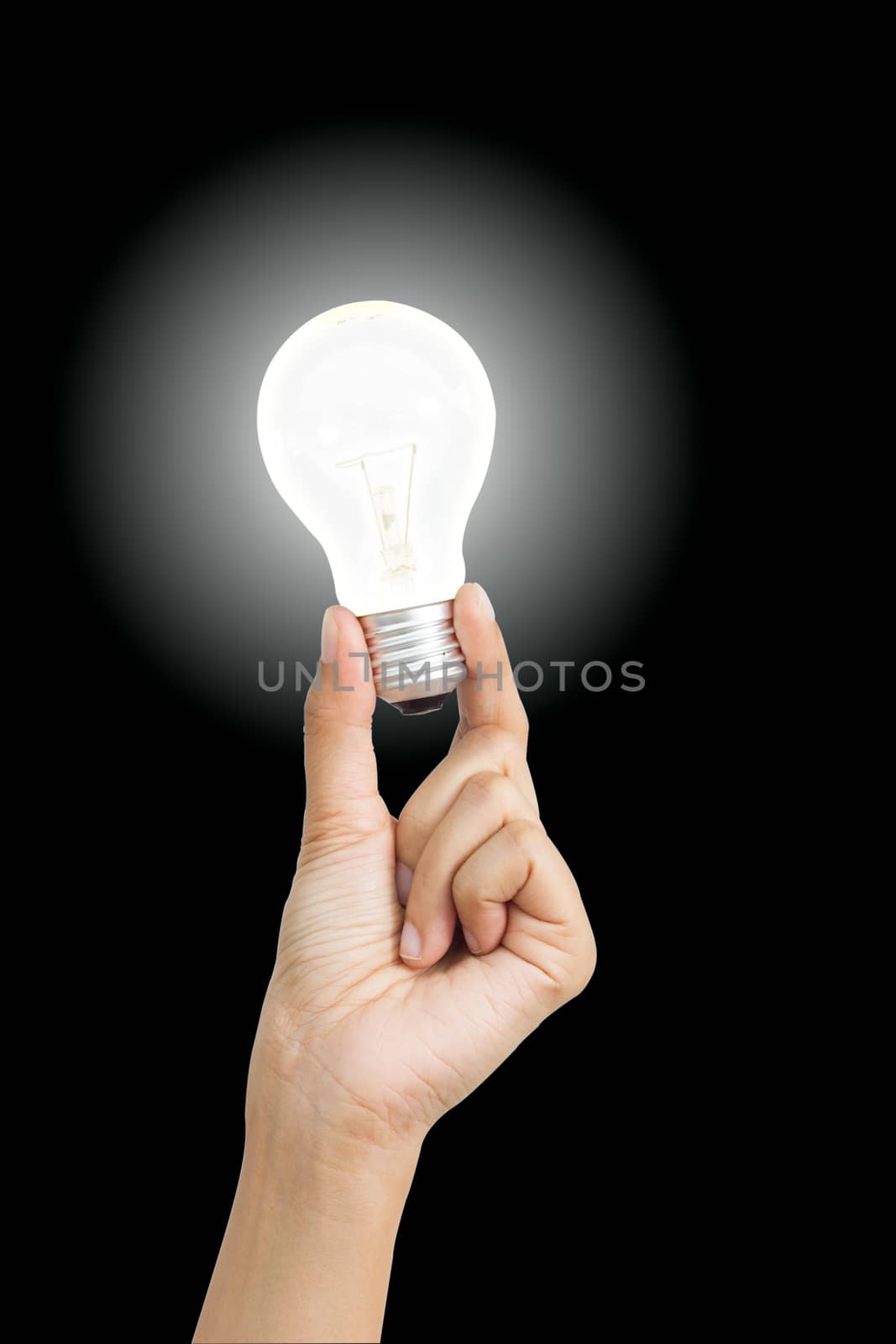 Hand holding light bulb symbolizing help, idea or inspiration by a3701027