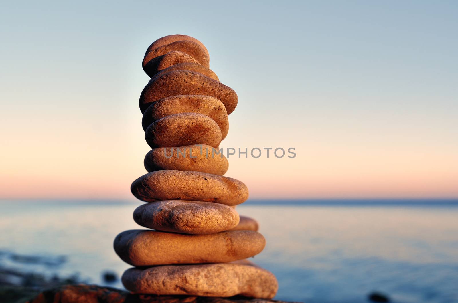 Balancing of stones each other on the seashore