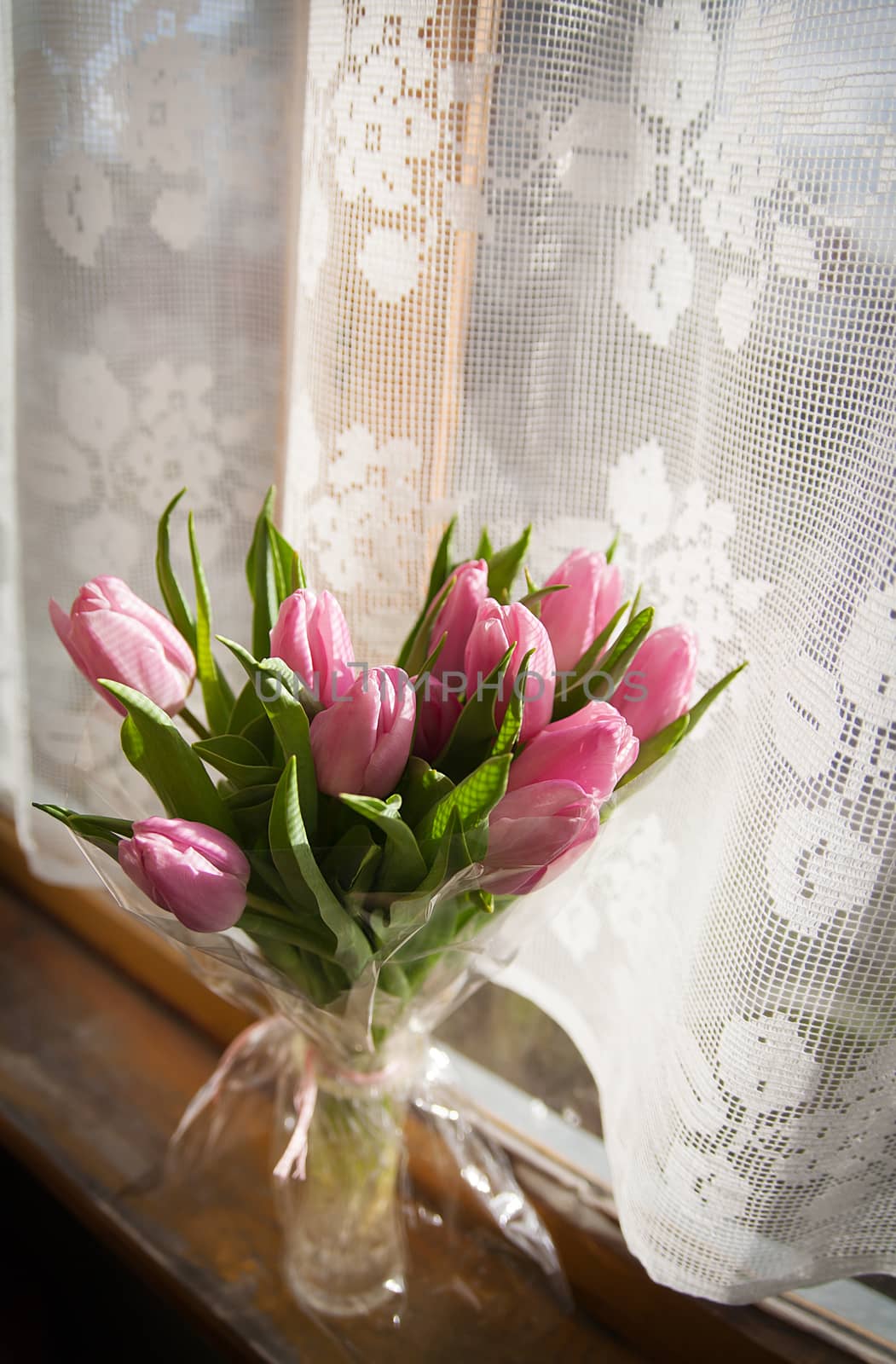 Beautiful flowers in vase near window by sfinks