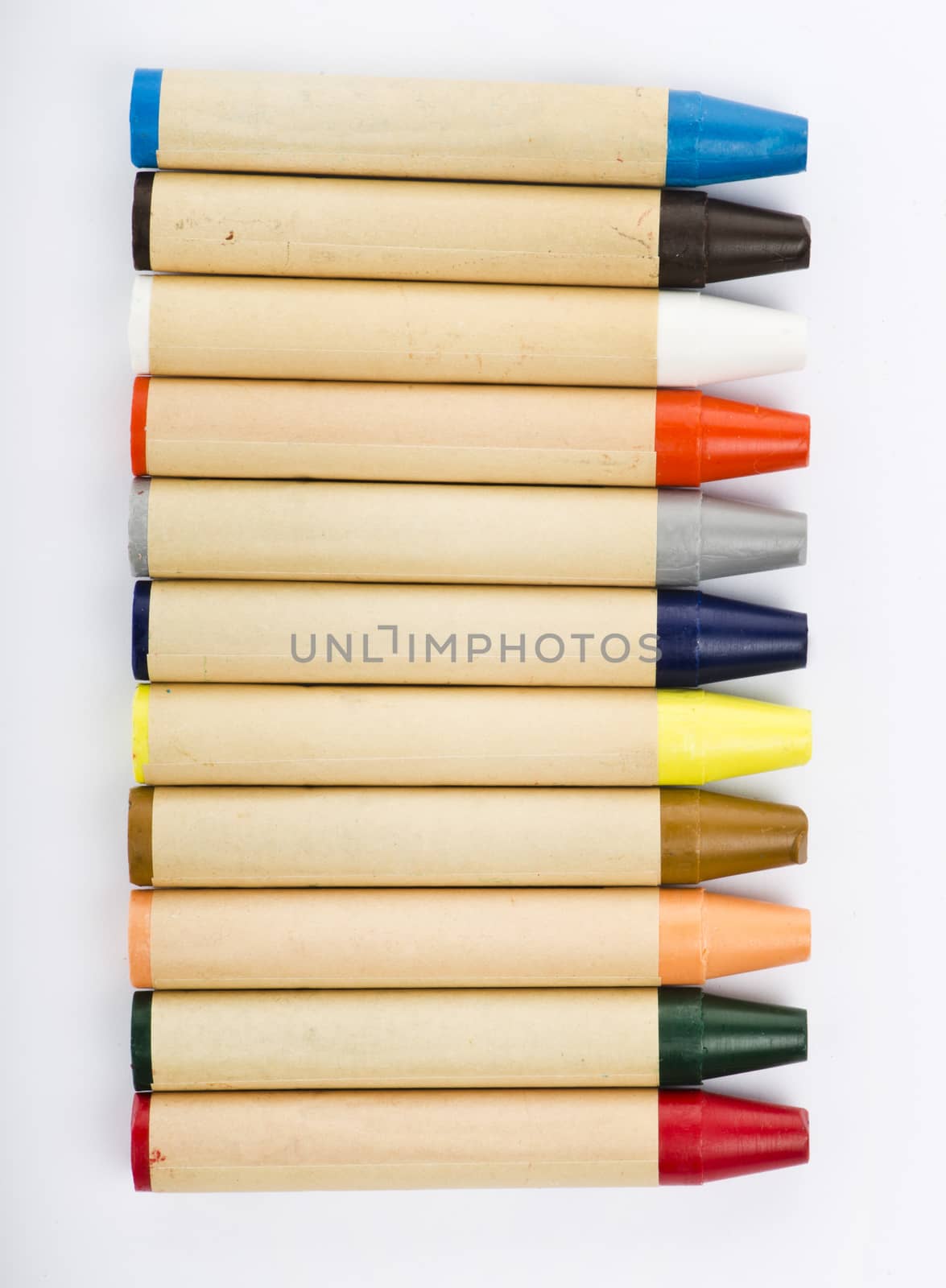Colour pencils on white background close up by marius_dragne