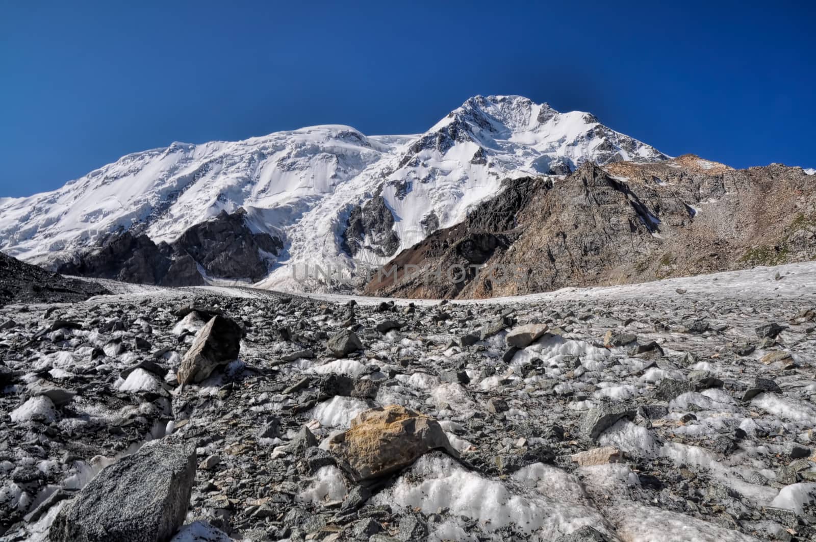 Scenic view of glacier and highest peaks in Tien-Shan mountain range in Kyrgyzstan