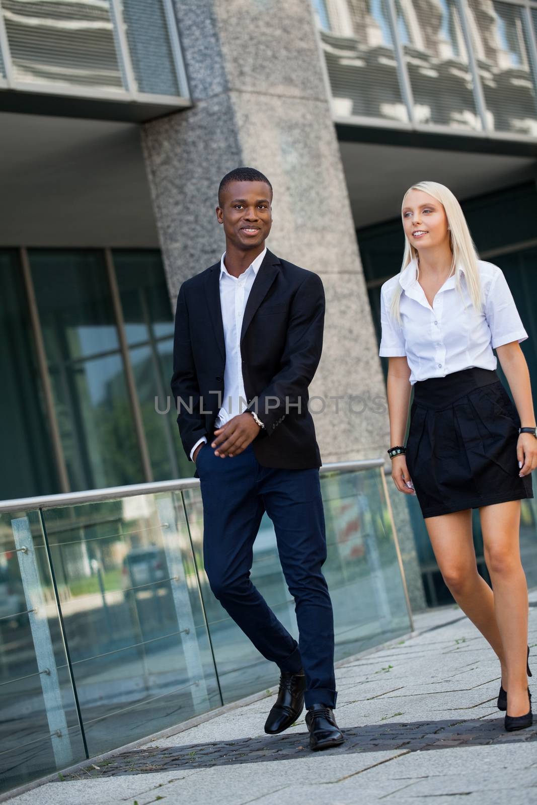 young successful business man and woman outdoor summer smiling