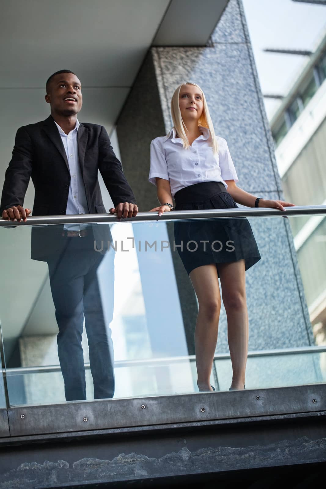 young successful business man and woman outdoor summer smiling