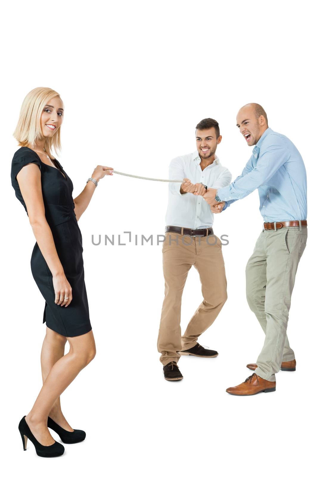 Beautiful strong fit woman demonstrating her dominance in a tug of war with two men pulling as hard as they can on the end of a rope she is holding while she remains nonchalant and glamorous, on white