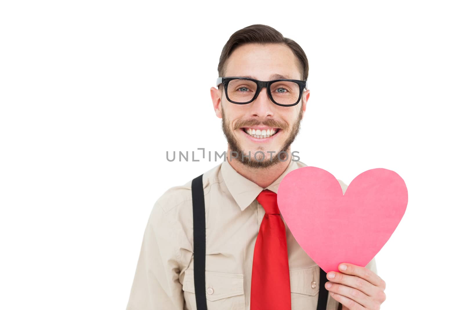Geeky hipster smiling and holding heart card on white background