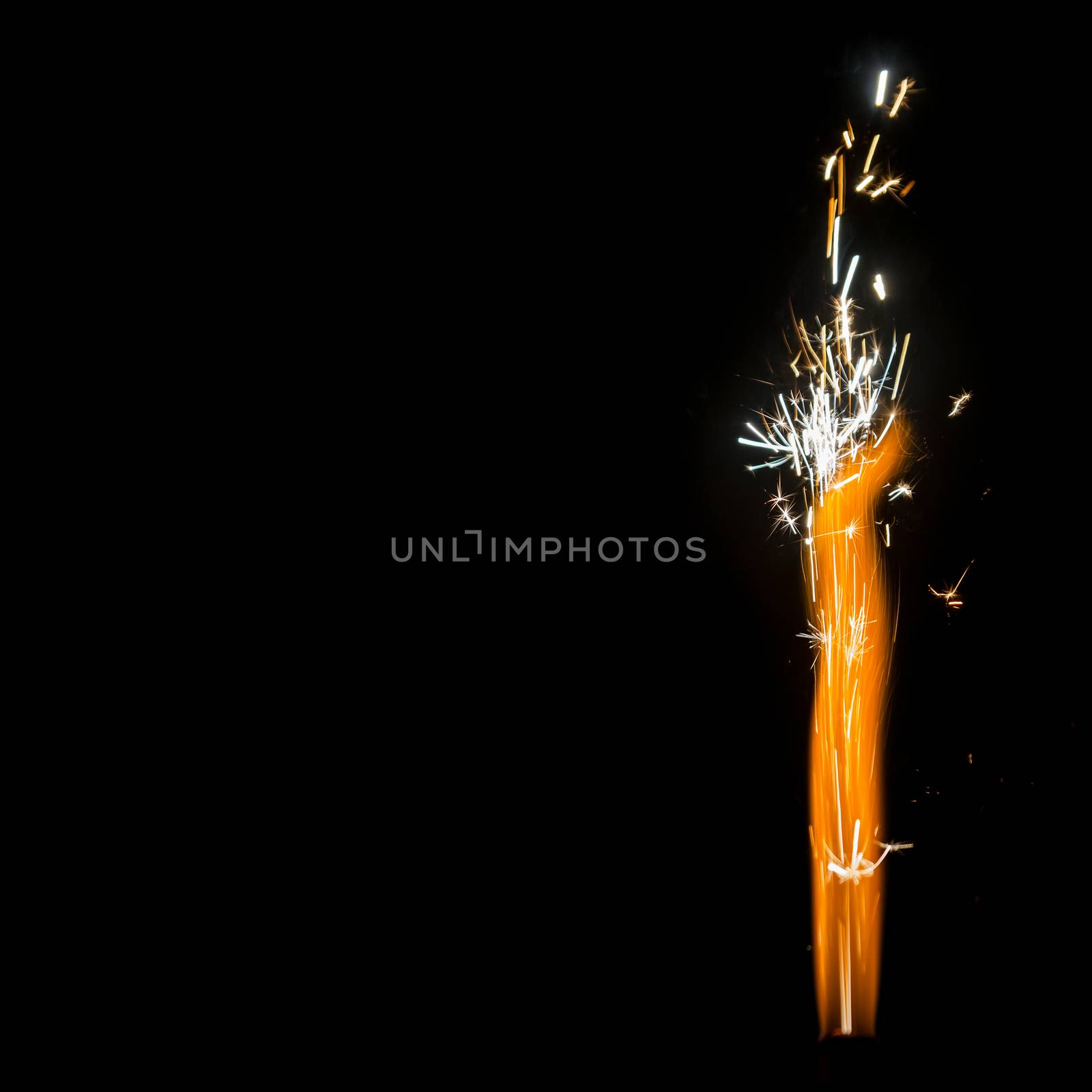 Burning Firework Sparkler Detail  isolated on black with huge copy-space, square