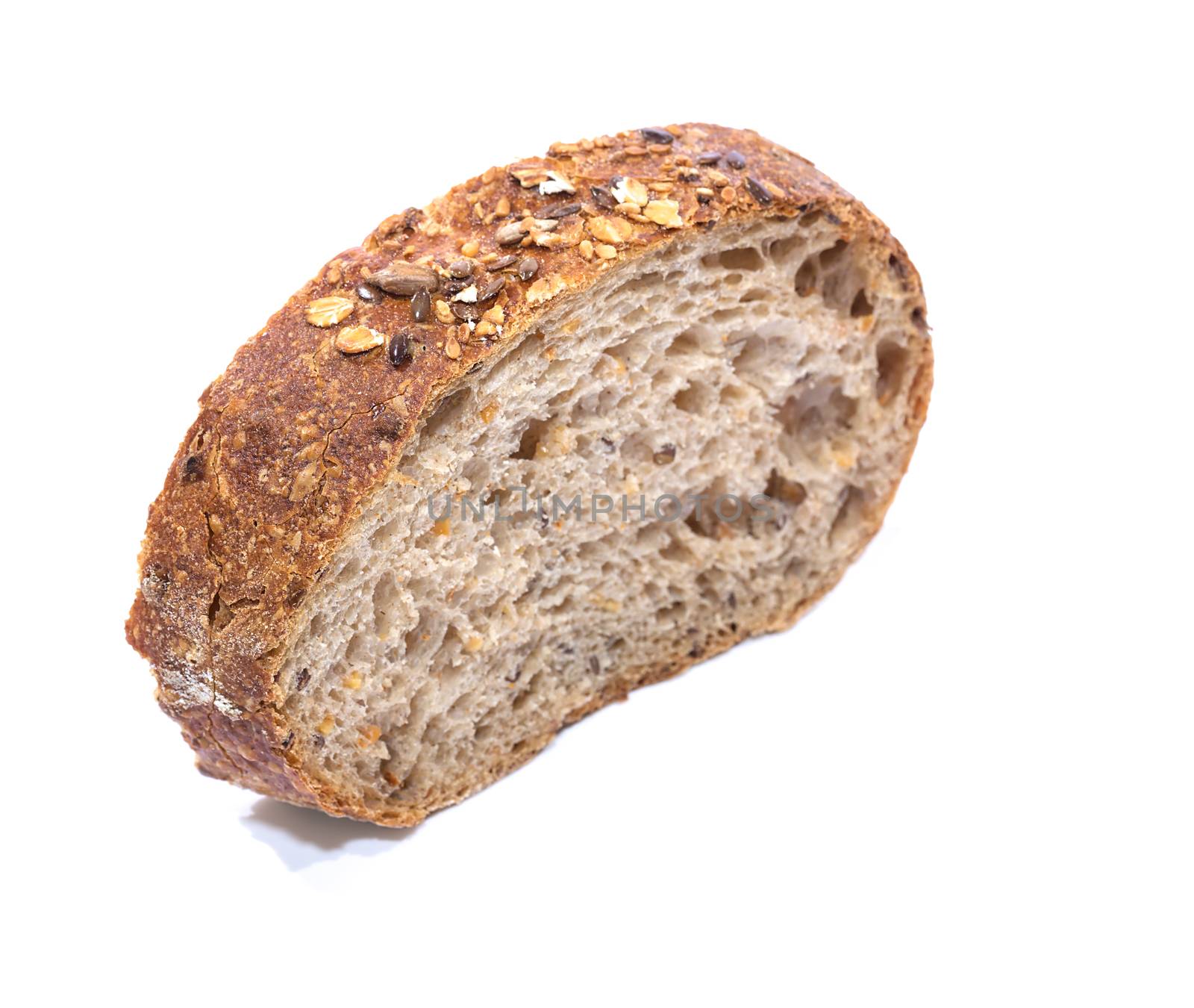 Whole grain bread Slice over white background, diagonal view with shallow focus