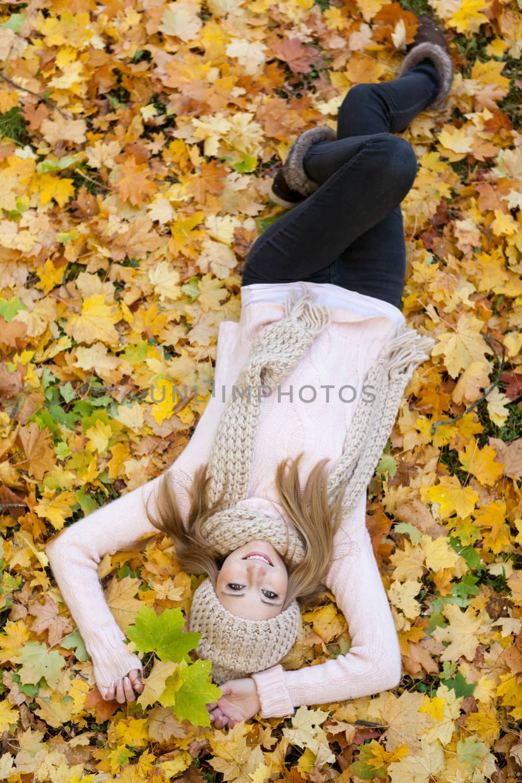 attractive young woman relaxing in atumn park outdoor by juniart