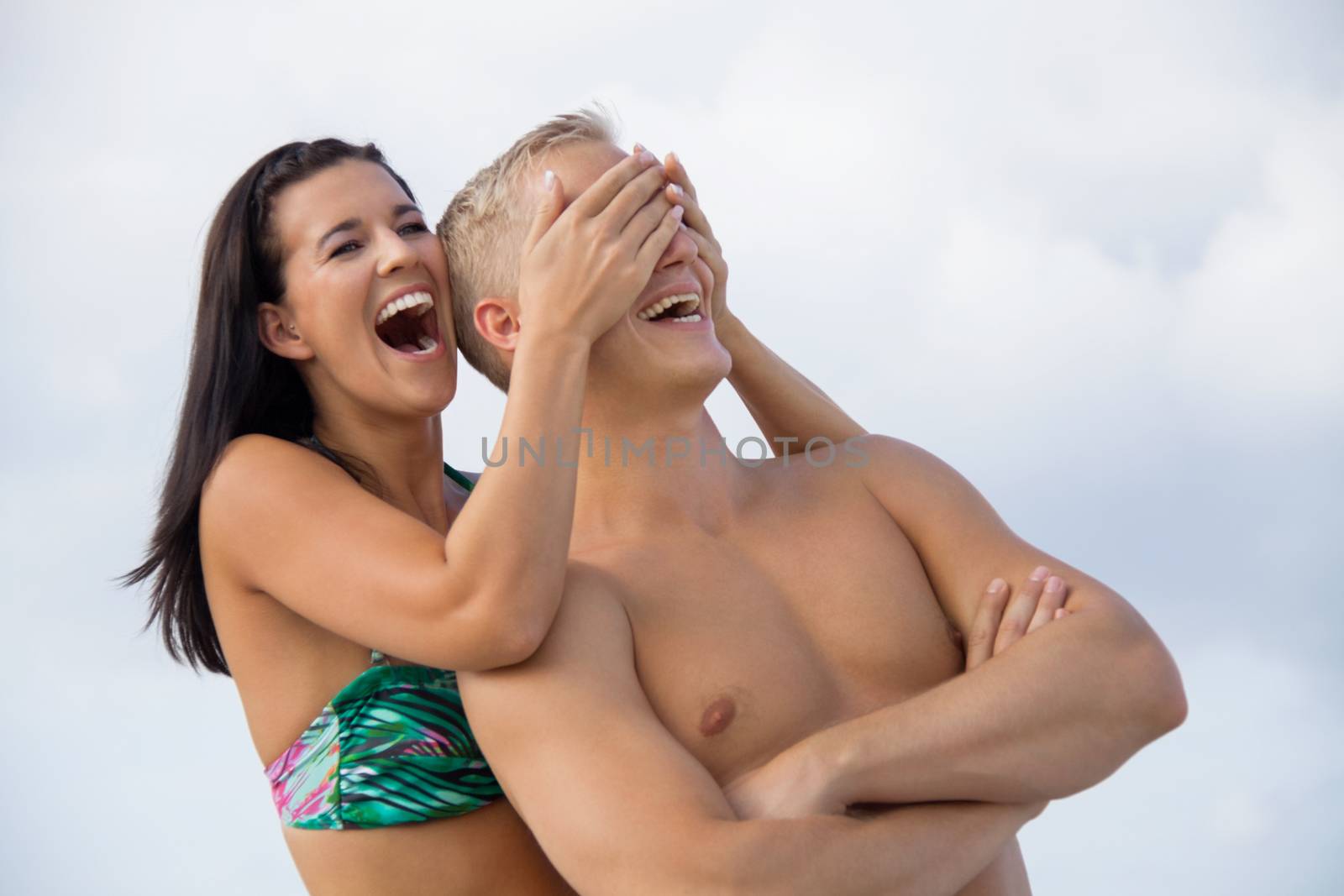 smiling young couple having fun in summer holiday by juniart