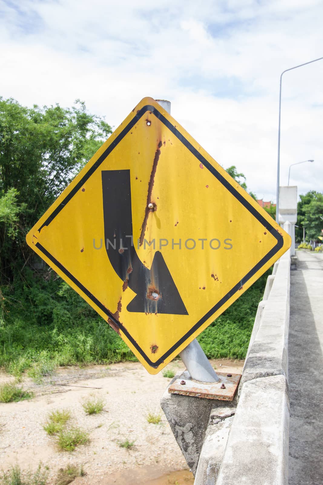 broken and old road sign on the bridge in thailand