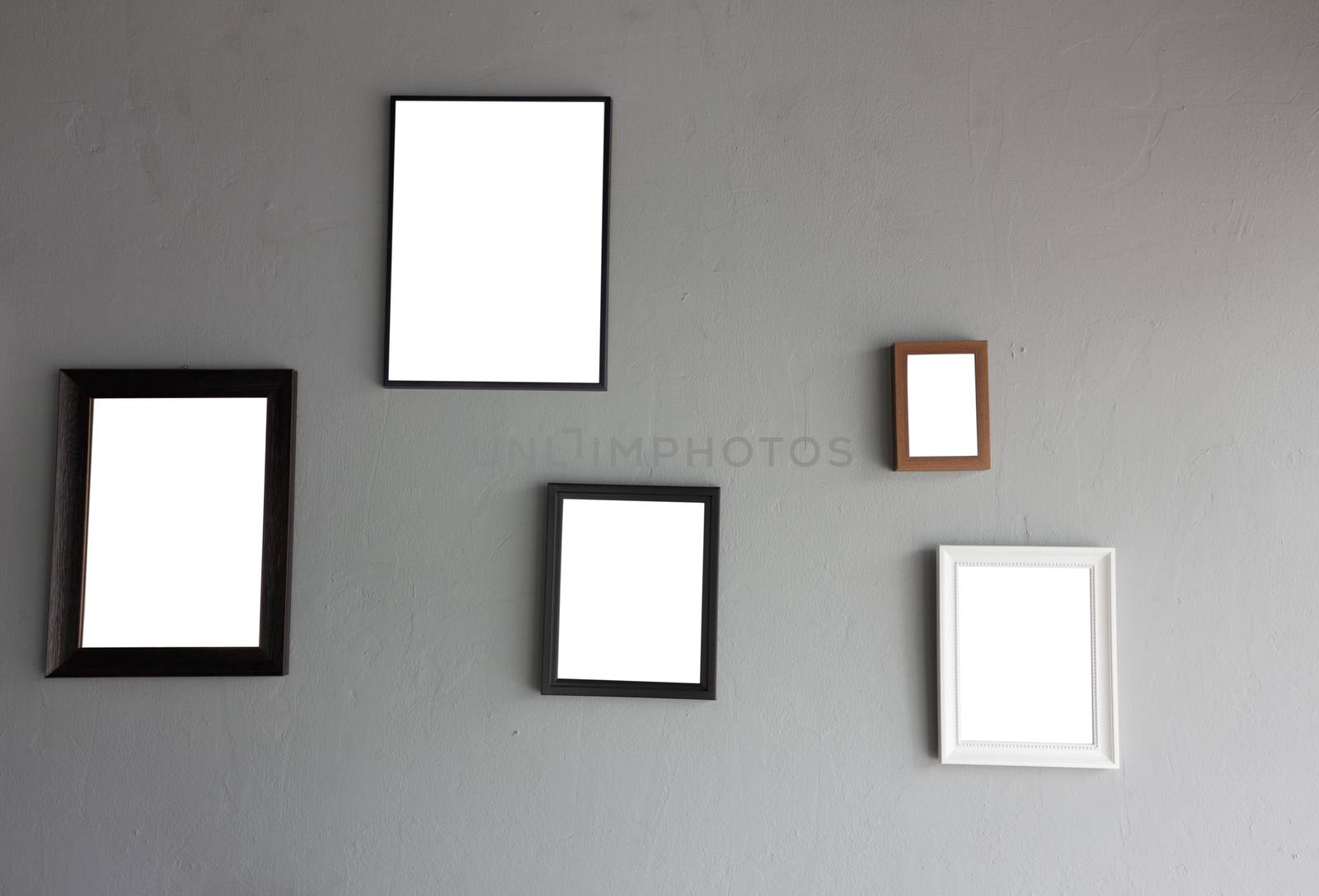 Vintage wooden frame on concrete background.