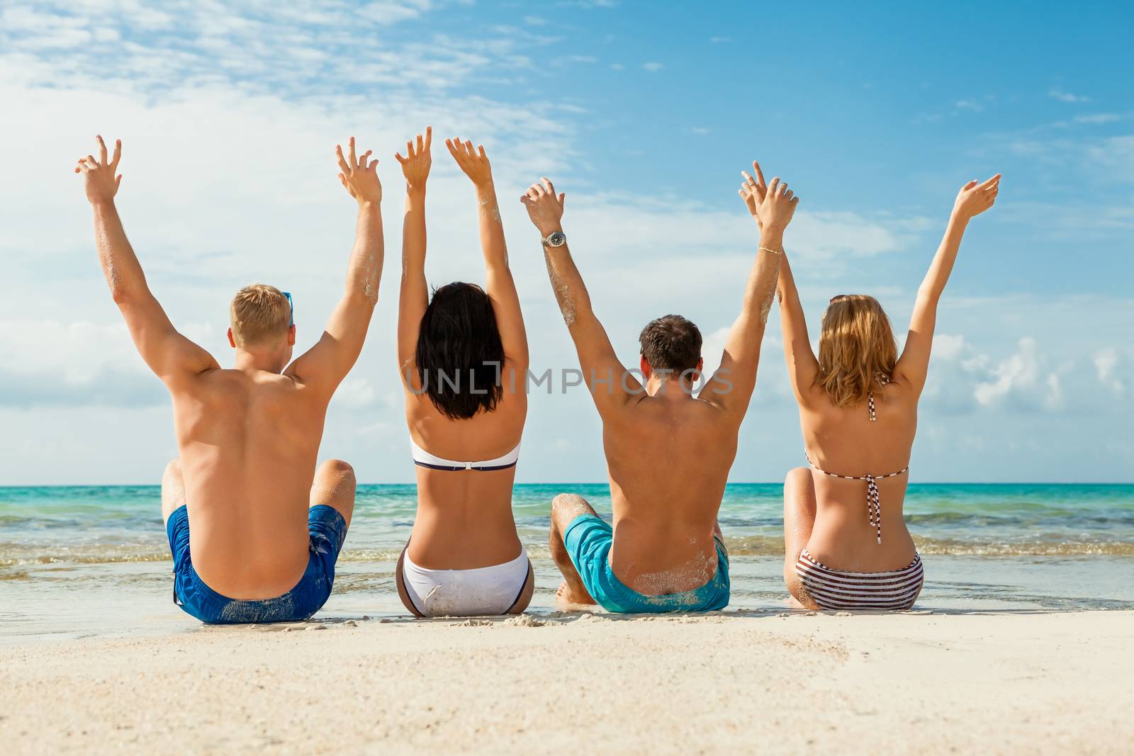 young happy friends havin fun on the beach summer holidays lifestyle