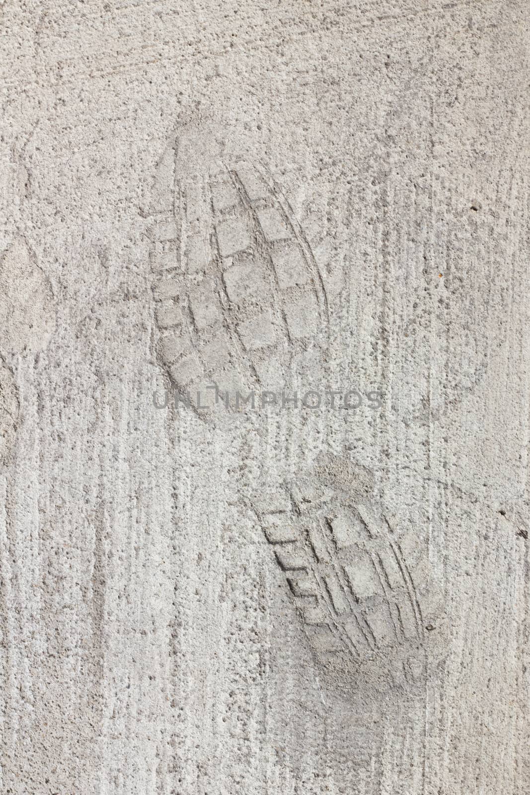 Man footprints on concrete track