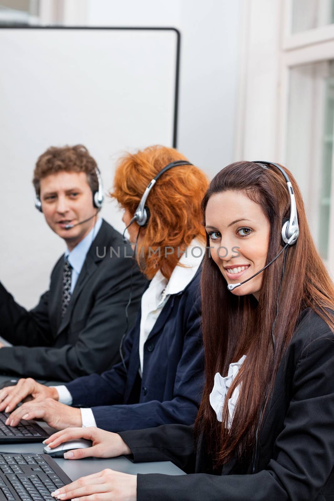 friendly callcenter agent operator with headset telephone  by juniart