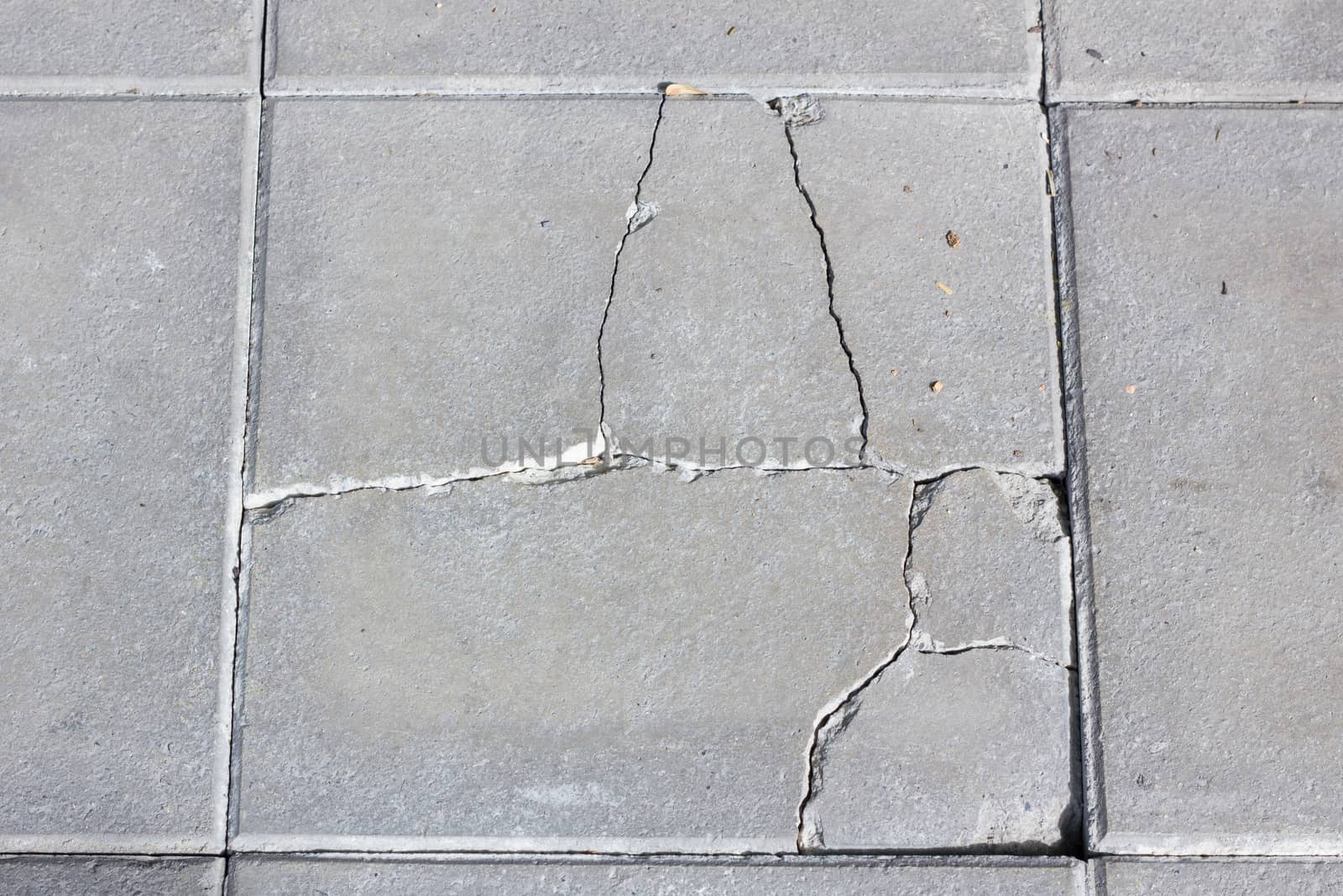 Cracked concrete texture closeup background