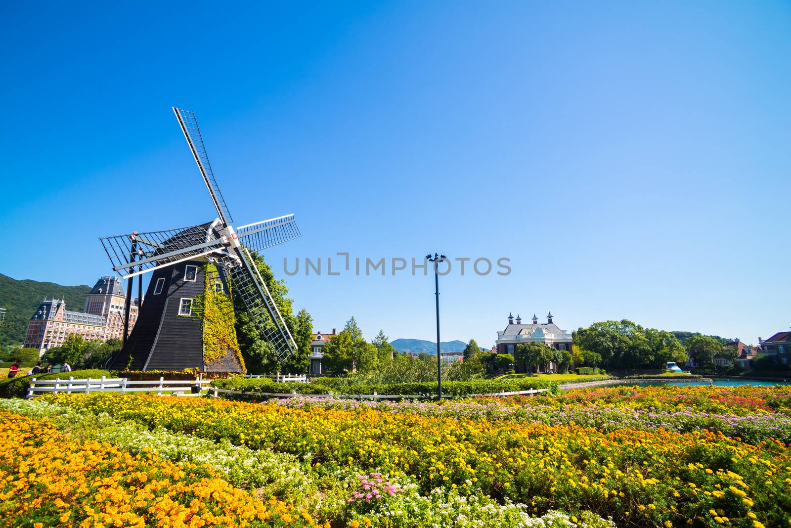 Windmill at Huis Ten Bosch stand in a bright and clear sky, Japan