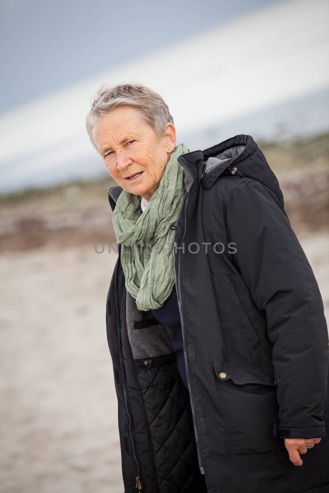 happy grey-haired elderly woman senior outdoor by juniart