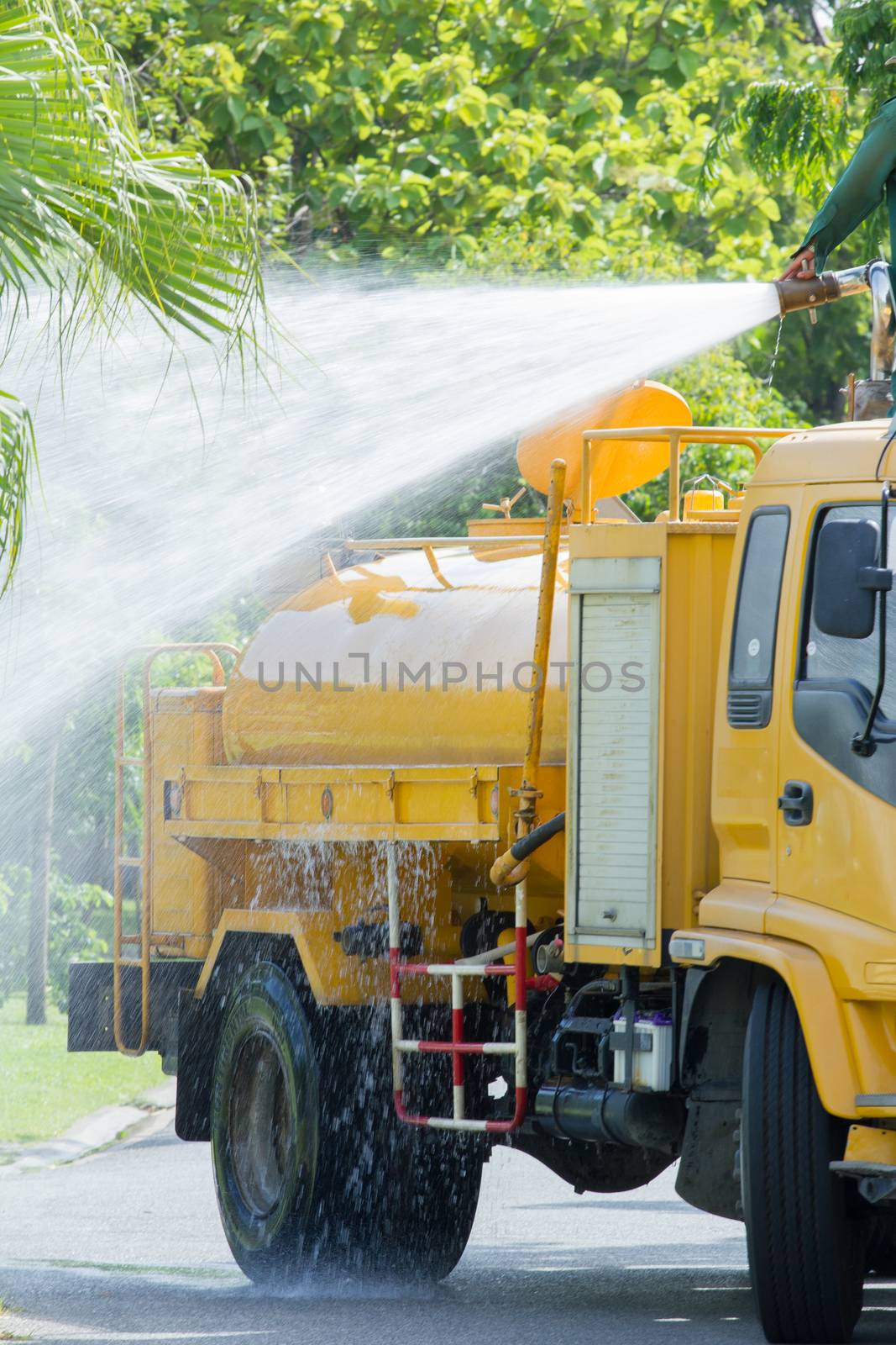 water truck watering in the garden, in thailand