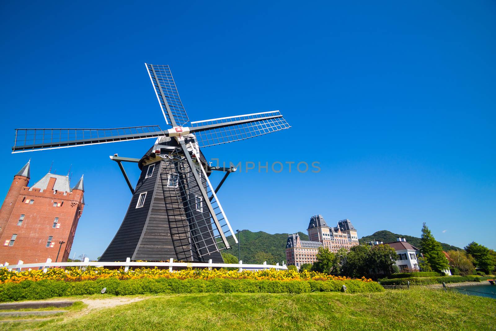 Windmill at Huis Ten Bosch stand in a bright and clear sky, Japan