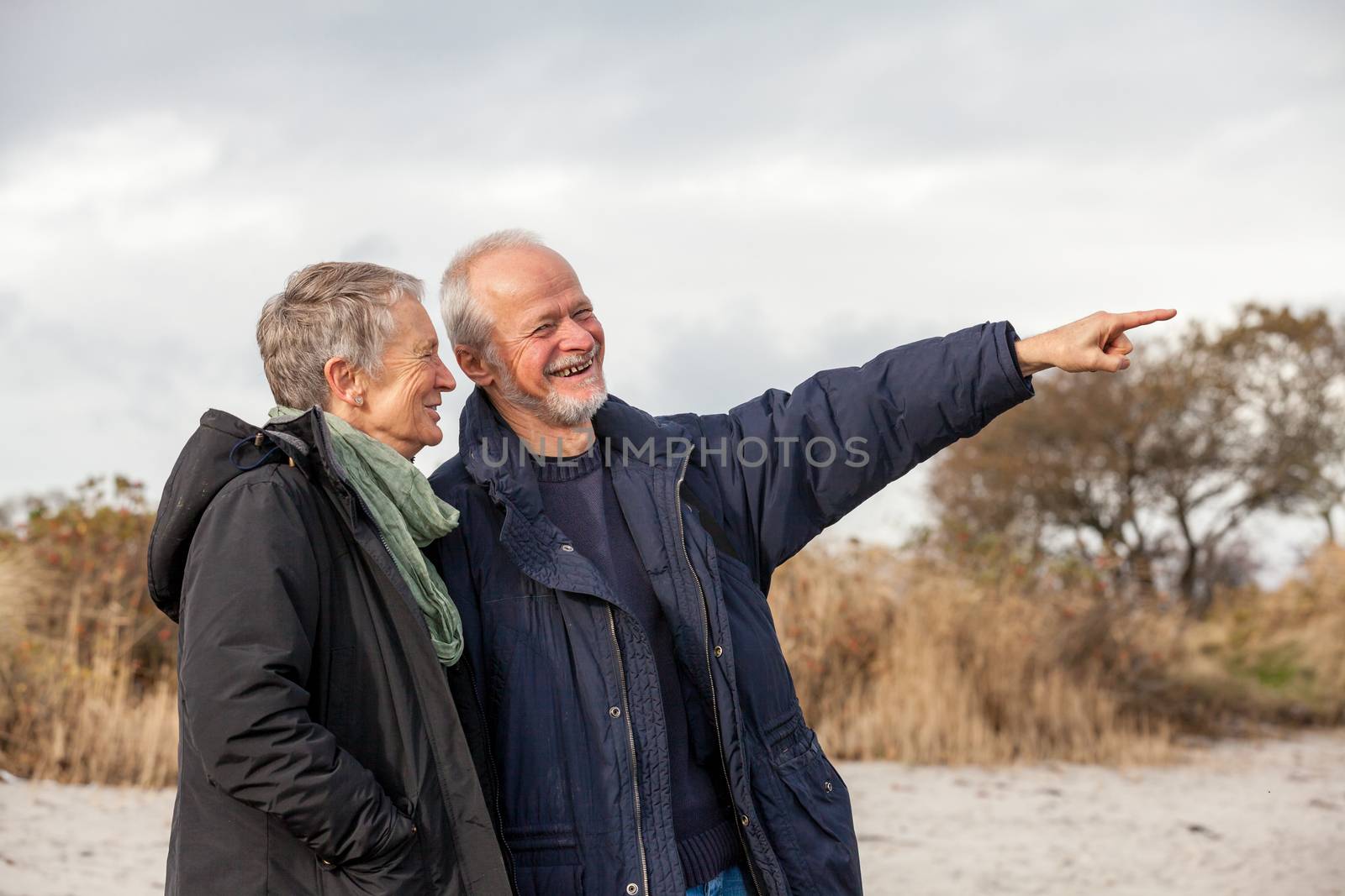 happy senior couple elderly people together outdoor in autumn winter