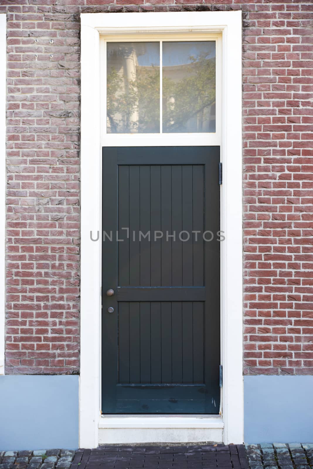 Vintage black door in front of the house