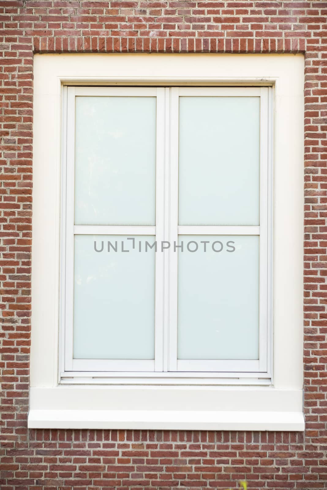 White color vintage style window with brick wall