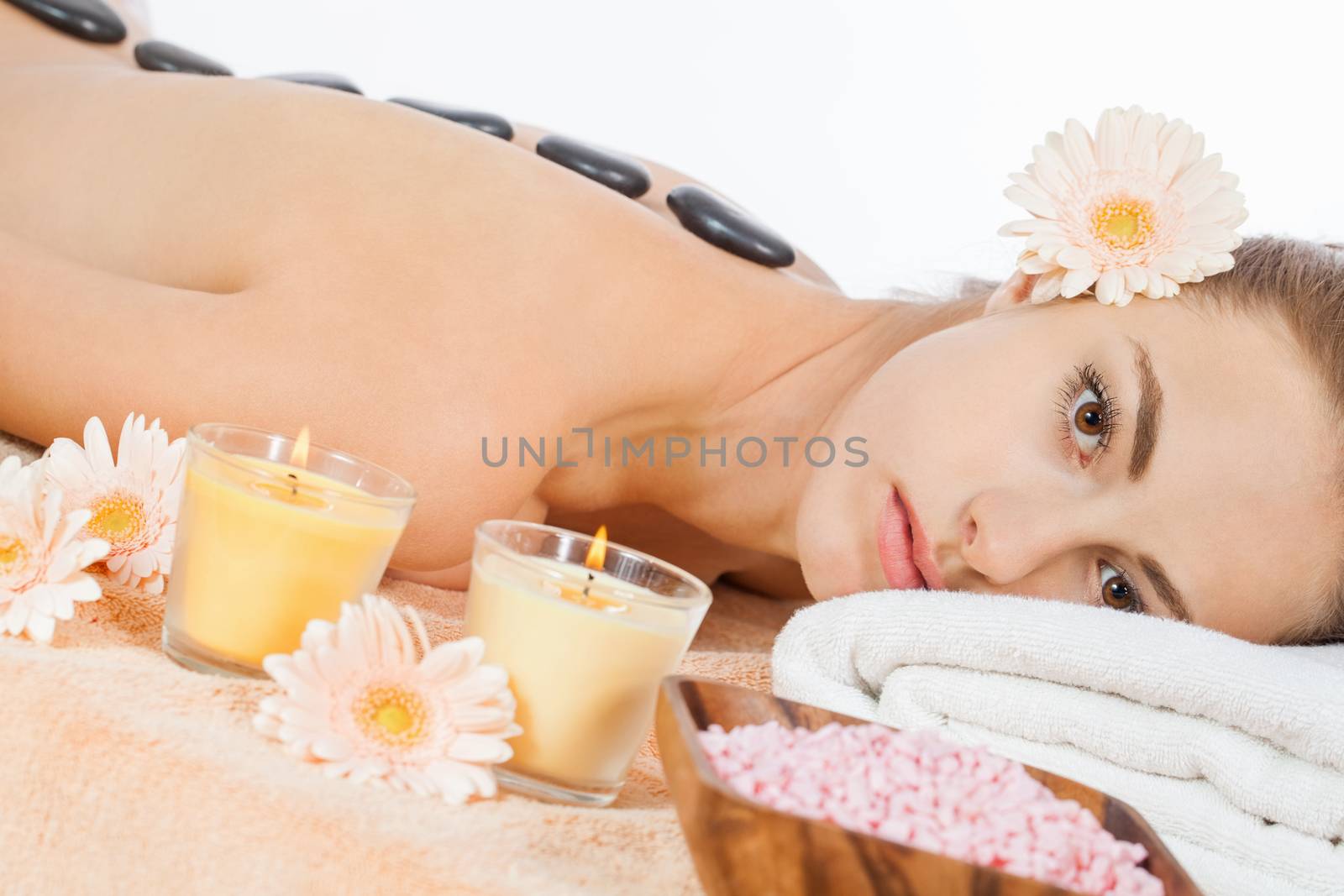 attractive healthy caucasian woman hot stone massage wellness  spa therapy